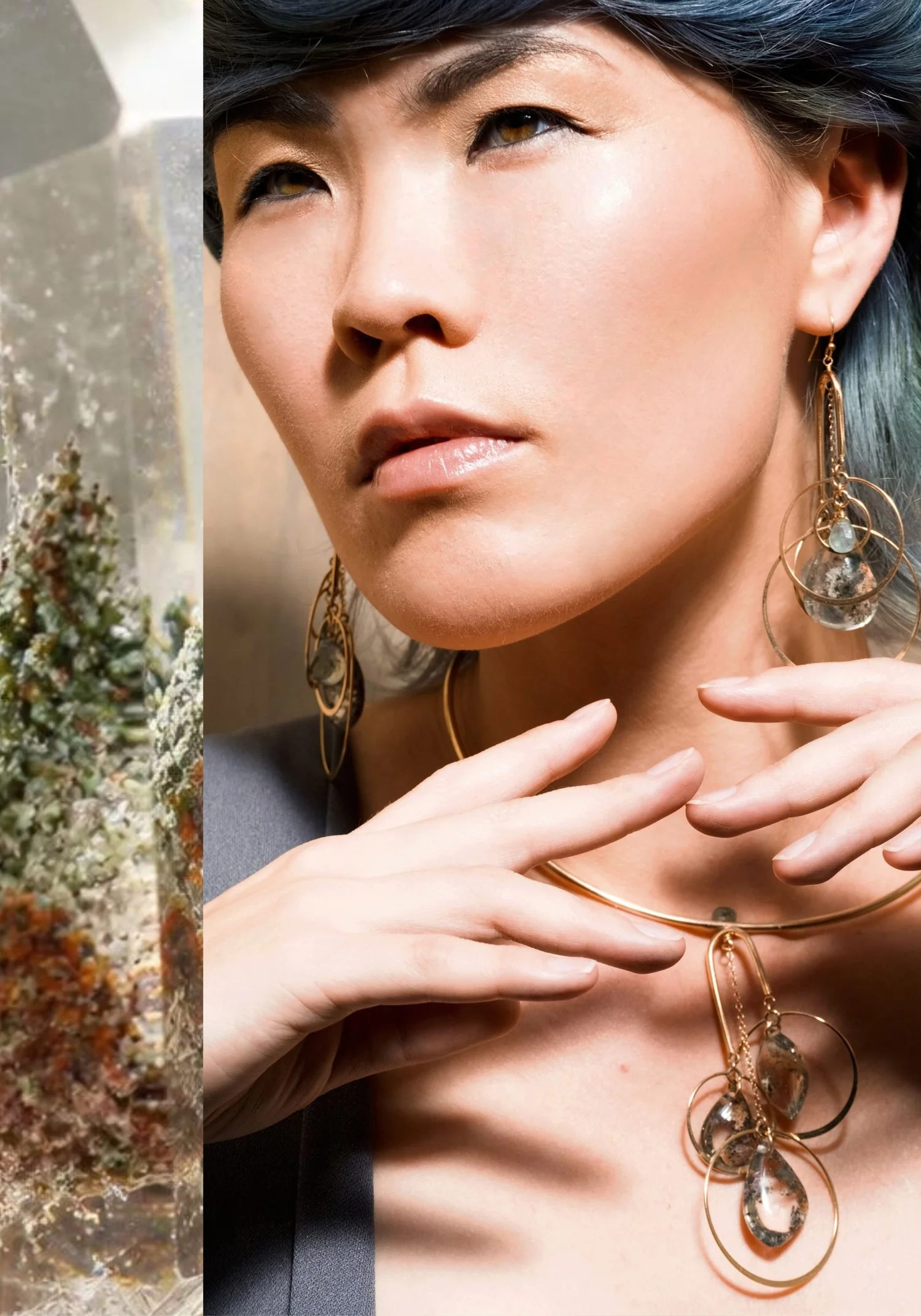 A model with blue-gray hair wearing open gold hoop earrings and a gold collar necklace hung with layered hoops, both set with garden quartz
