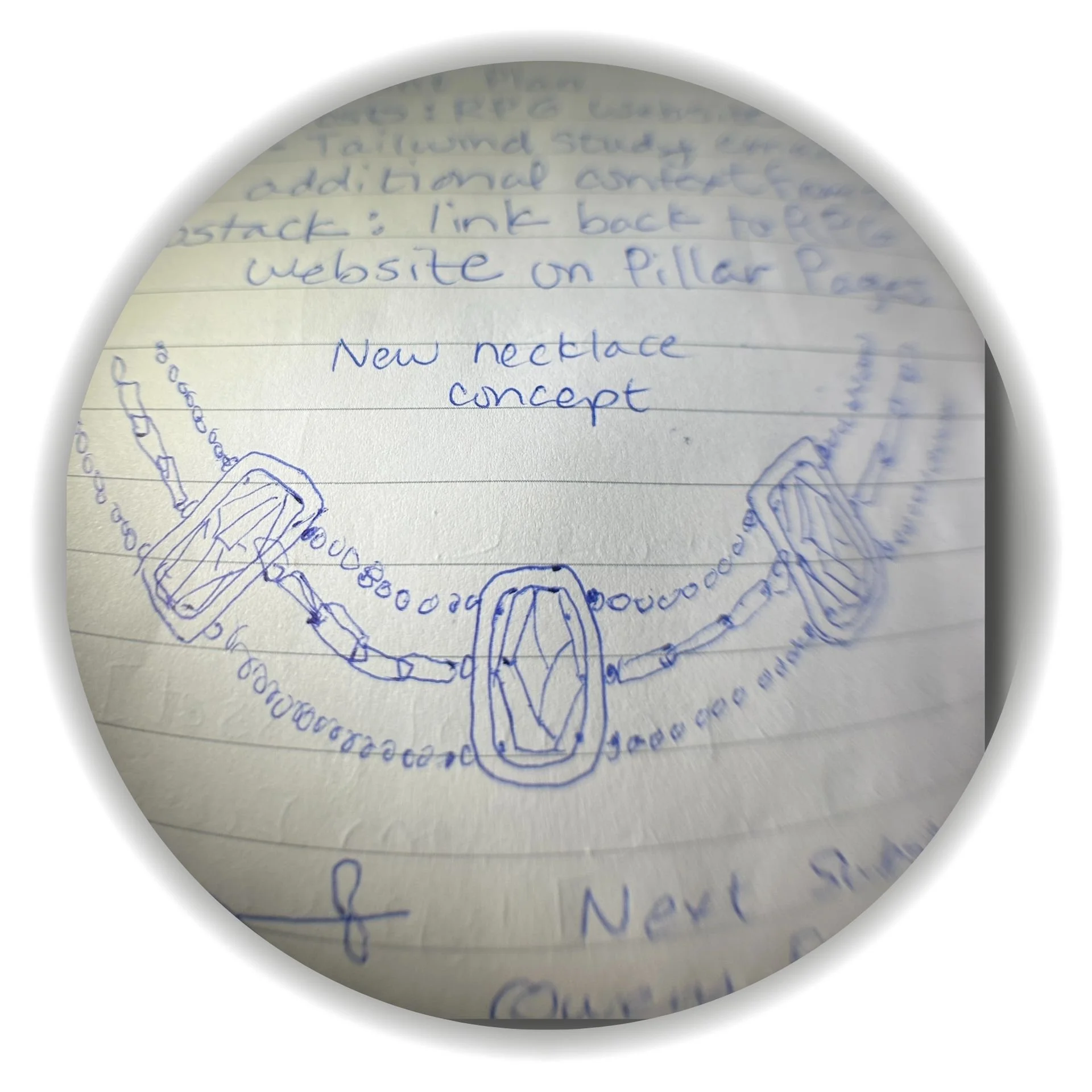 Hand-drawn “new necklace concept” sketch in blue ink on lined notebook paper, showing a three-stone rectangular pendant design with chain links and bead accents draped in a curved necklace layout.