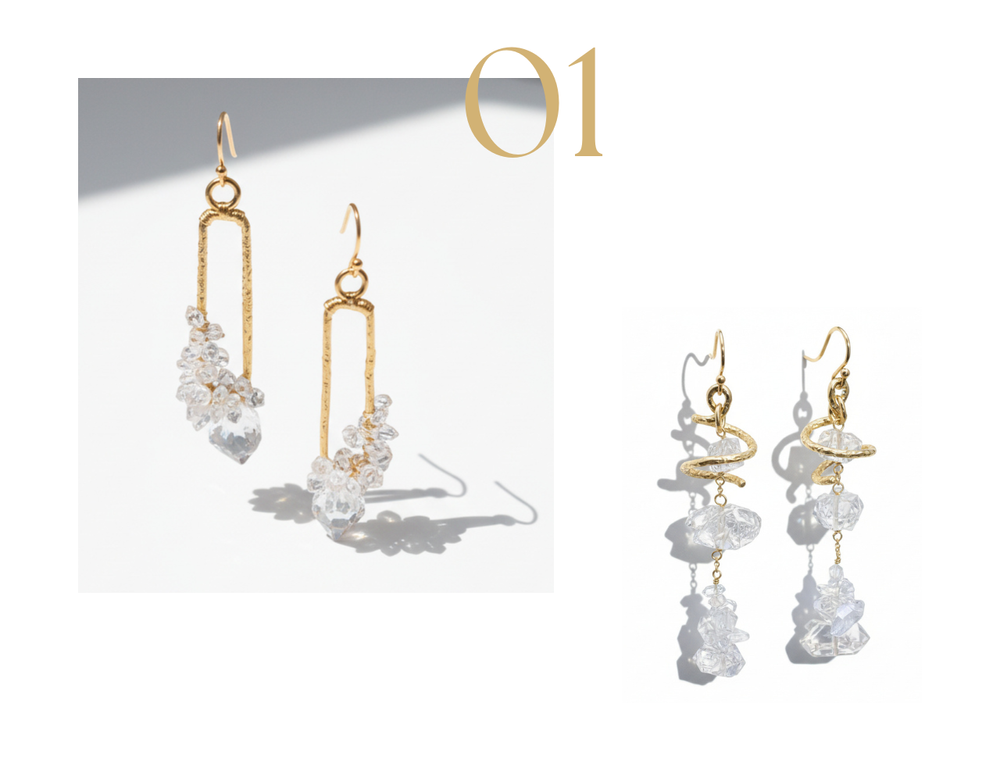 Product photo of two pairs of gold Herkimer diamond drop earrings, one with rectangular gold links and crystal clusters, and one with a gold twist detail and dangling Herkimer diamond crystals, on a white background.