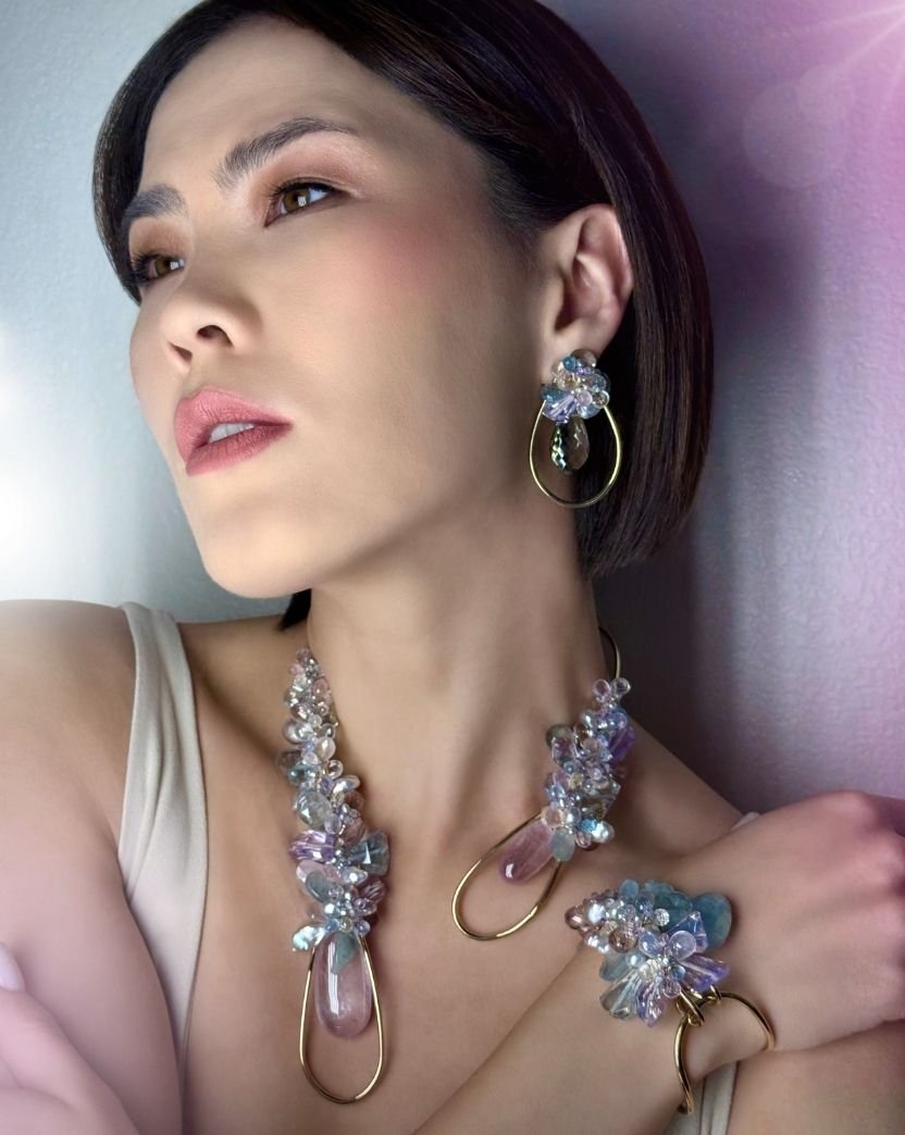 model wearing pastel choker bracelet and earrings