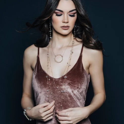 A model wearing three fine Andrea Li necklaces layered