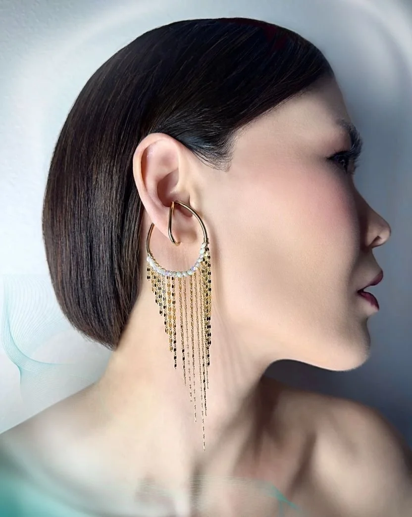 model wearing opal ear cuffs