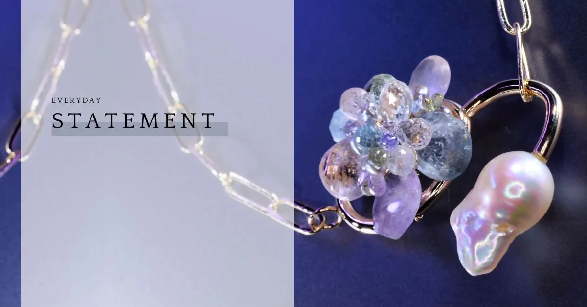 Split graphic with “Everyday Statement” text beside a close-up of a gold link necklace with pastel gemstones and a pearl drop.