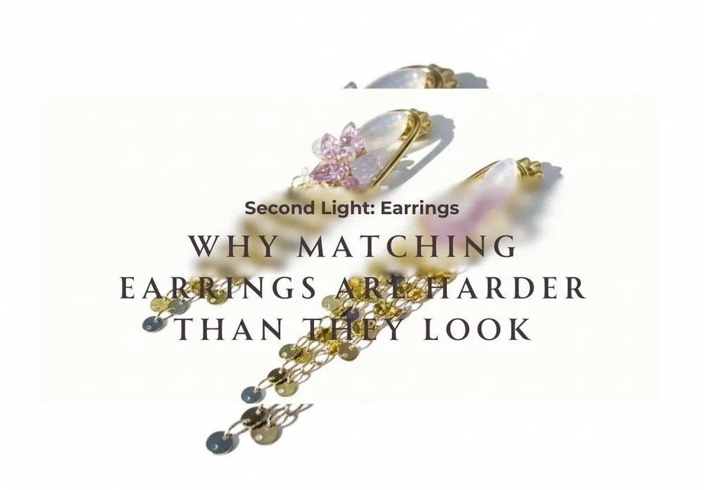 Second Light earrings with pale gemstones, pink crystal accents, gold settings, and cascading chain fringe shown with editorial text.