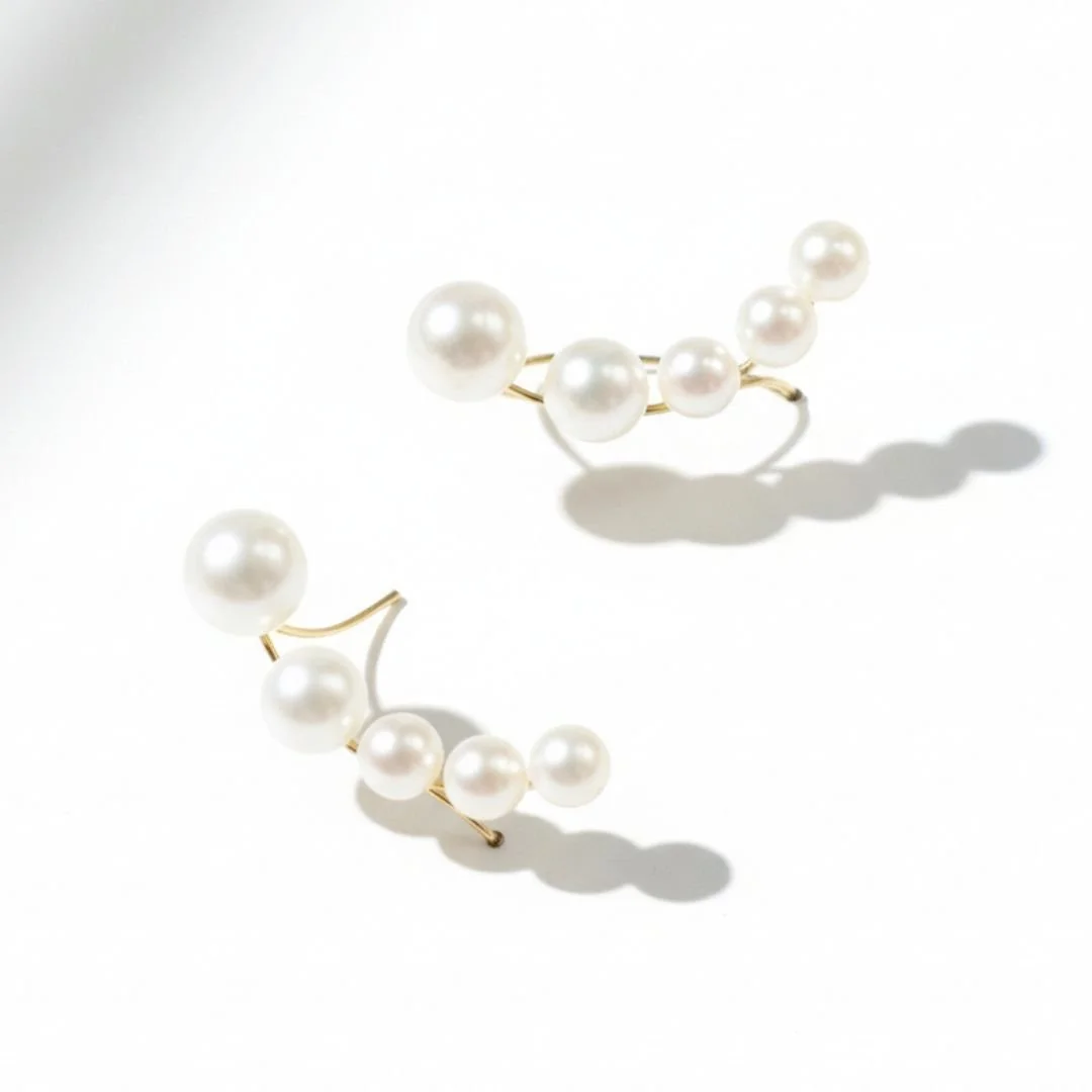 14k gold pearl ear climbers.jpg