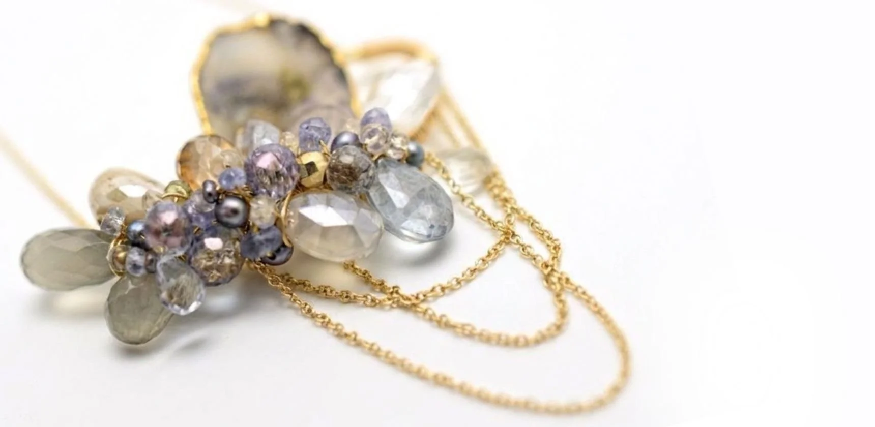 Closeup of a gold and gemstone necklace