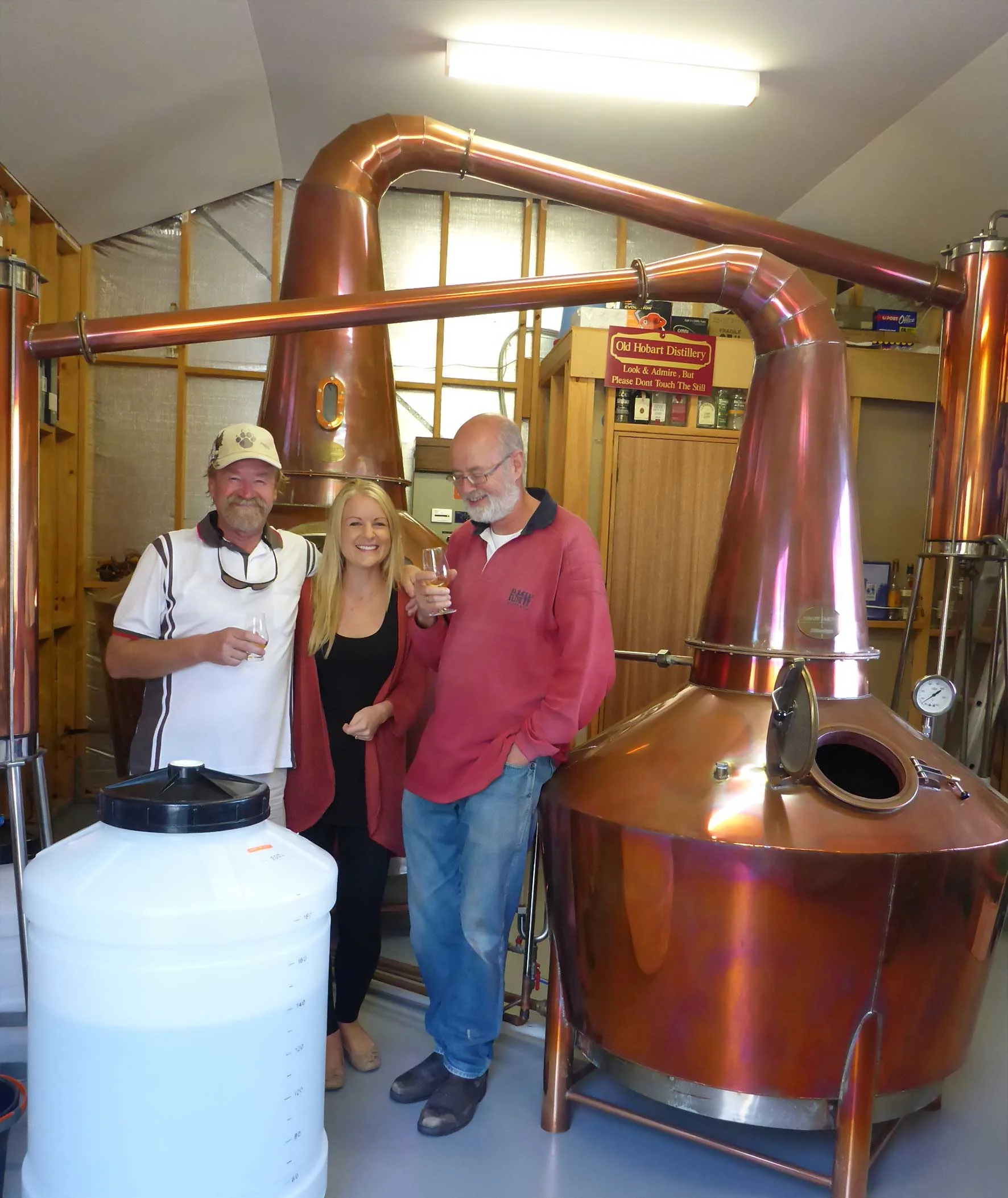 The brains behind Overeem Whisky: Casey and Jane Overeem with Wim, the distiller
