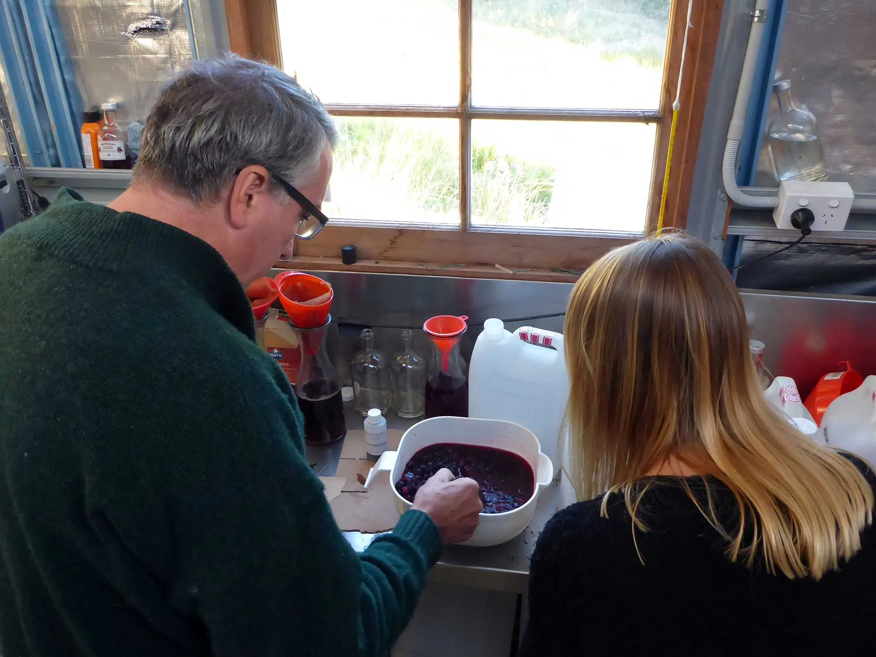 William McHenry showing us his sloe gin at McHenry Distillery