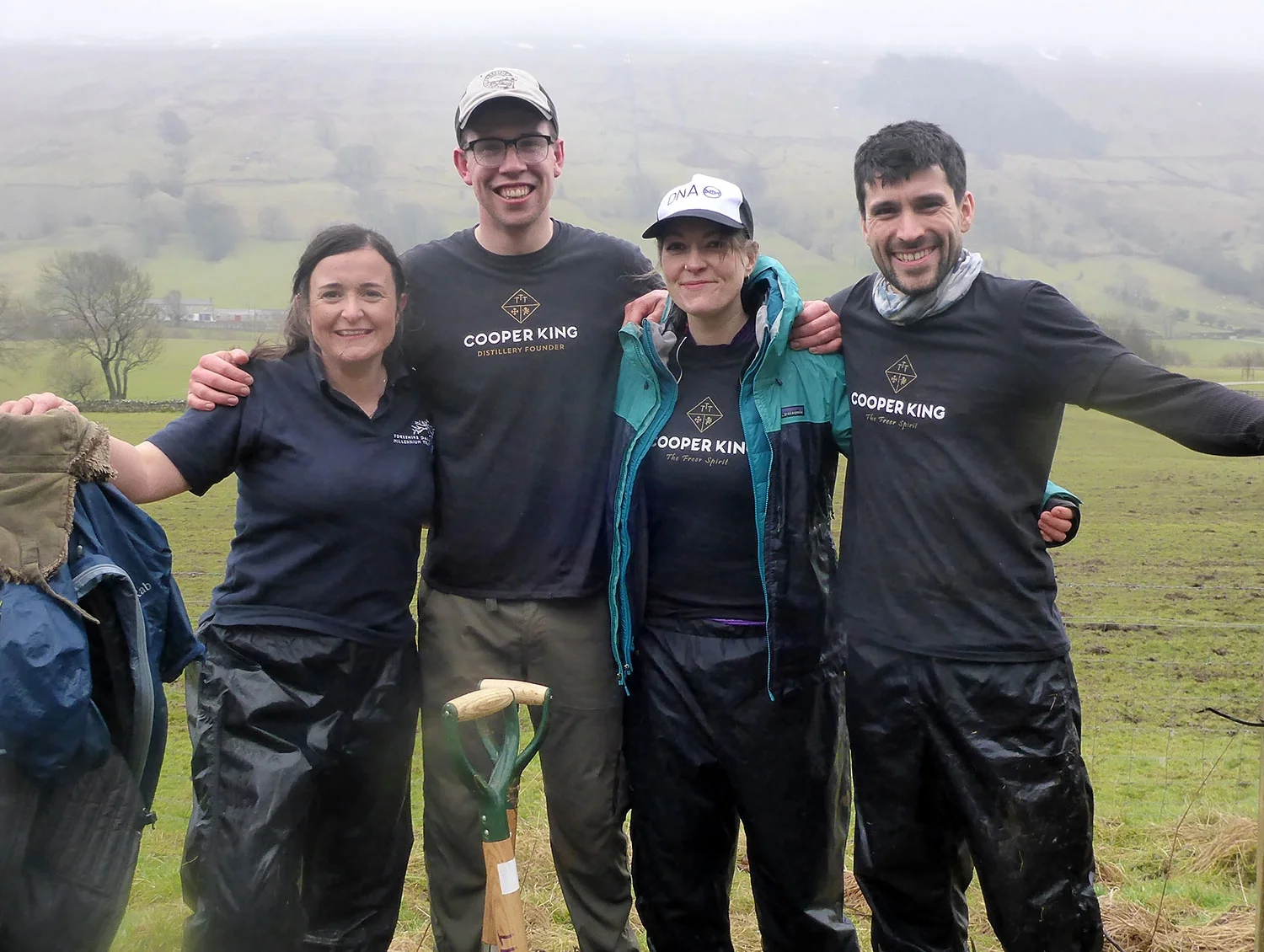 We’re wet because it’s March. We’re happy because we just planted over 100 trees!