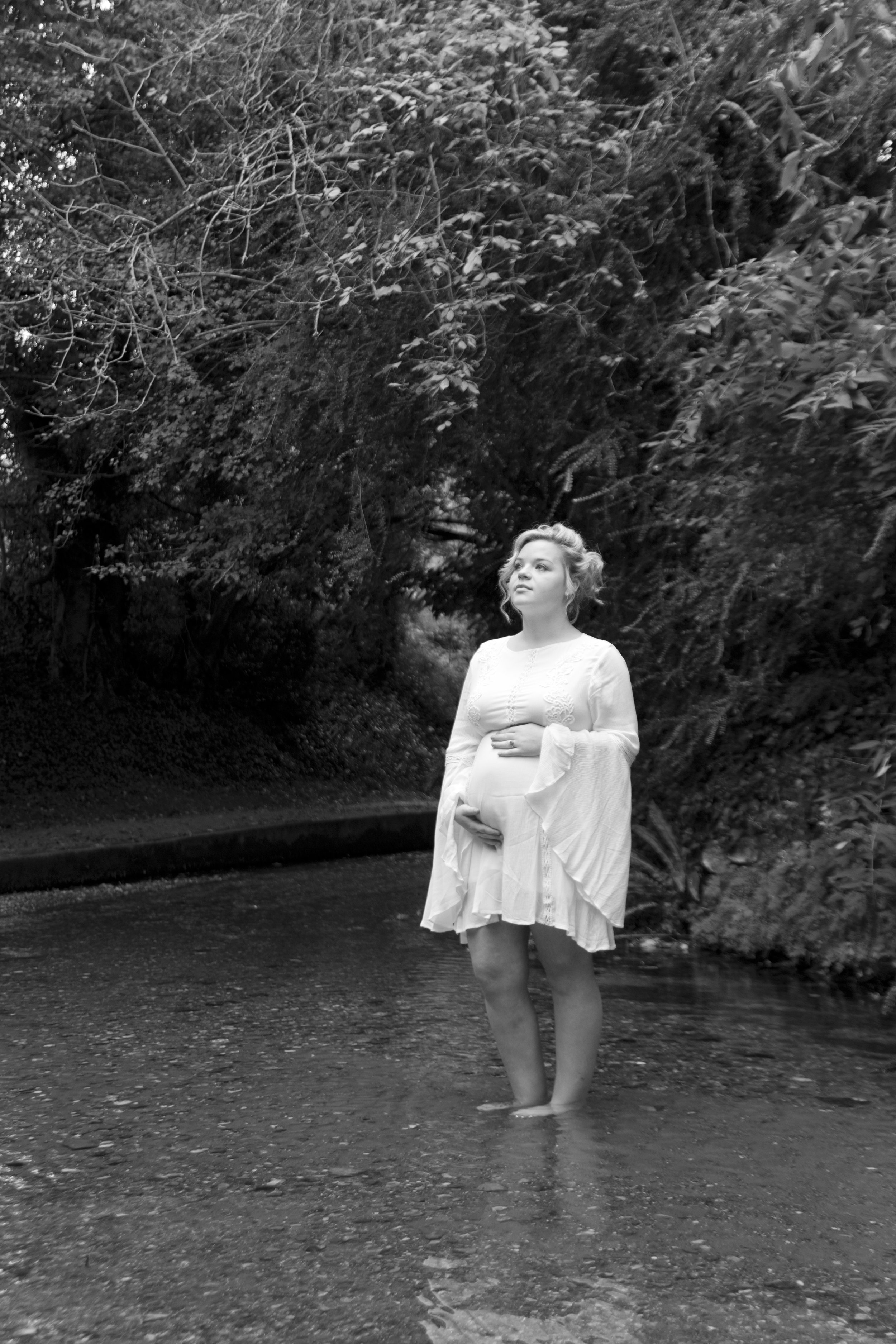 maternity mother stands water