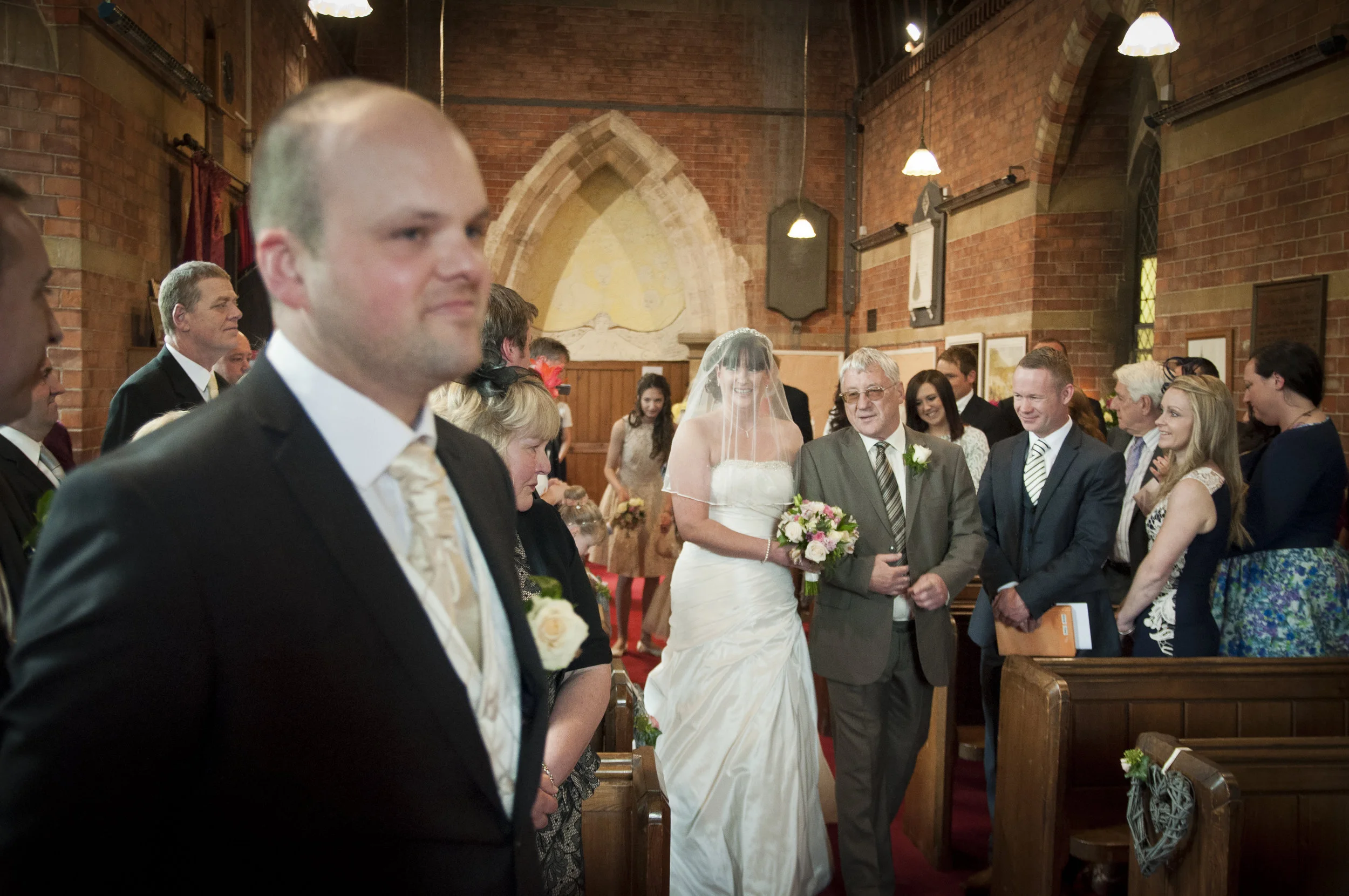 groom waiting for bride church wedding