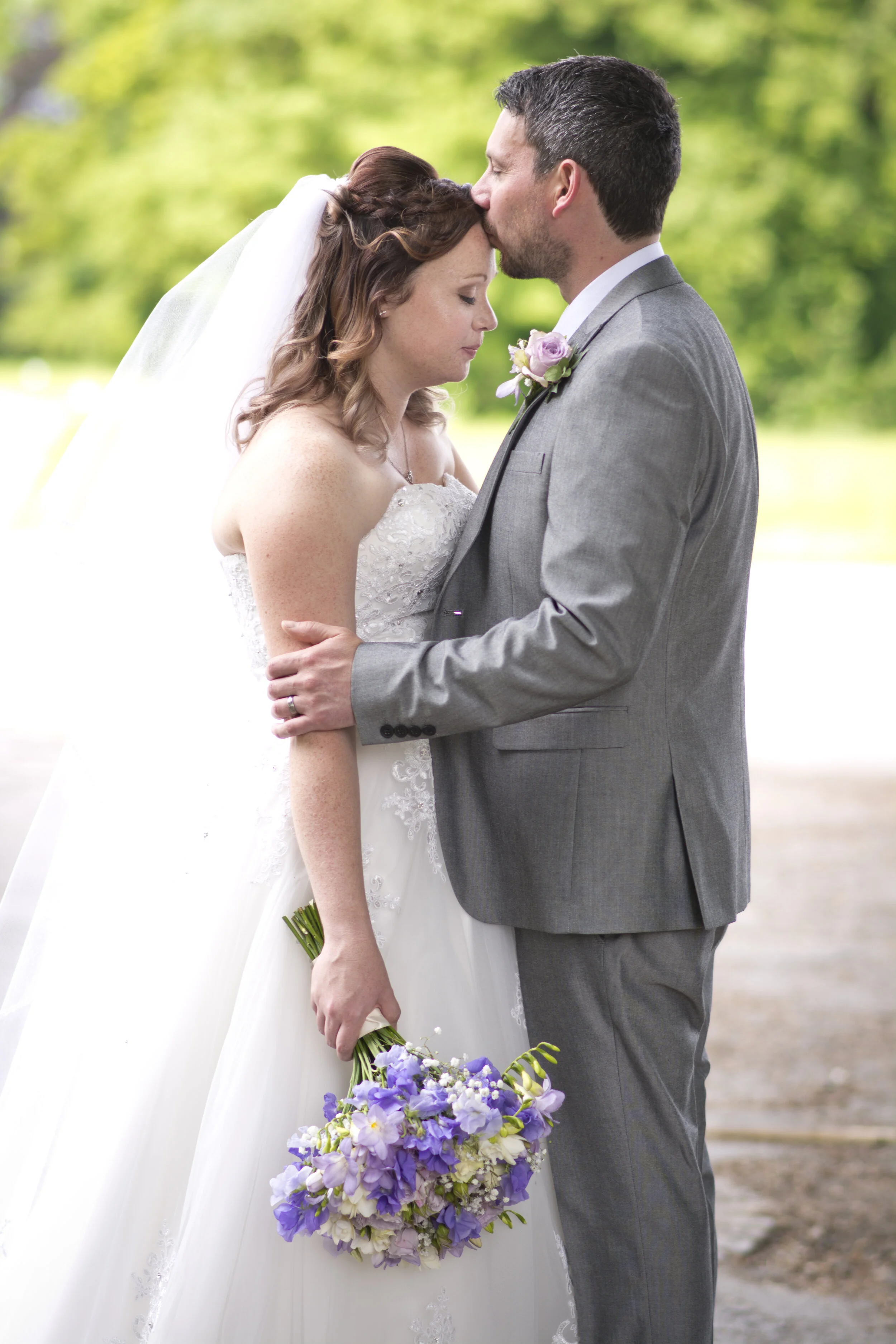 wedding groom kissing bride