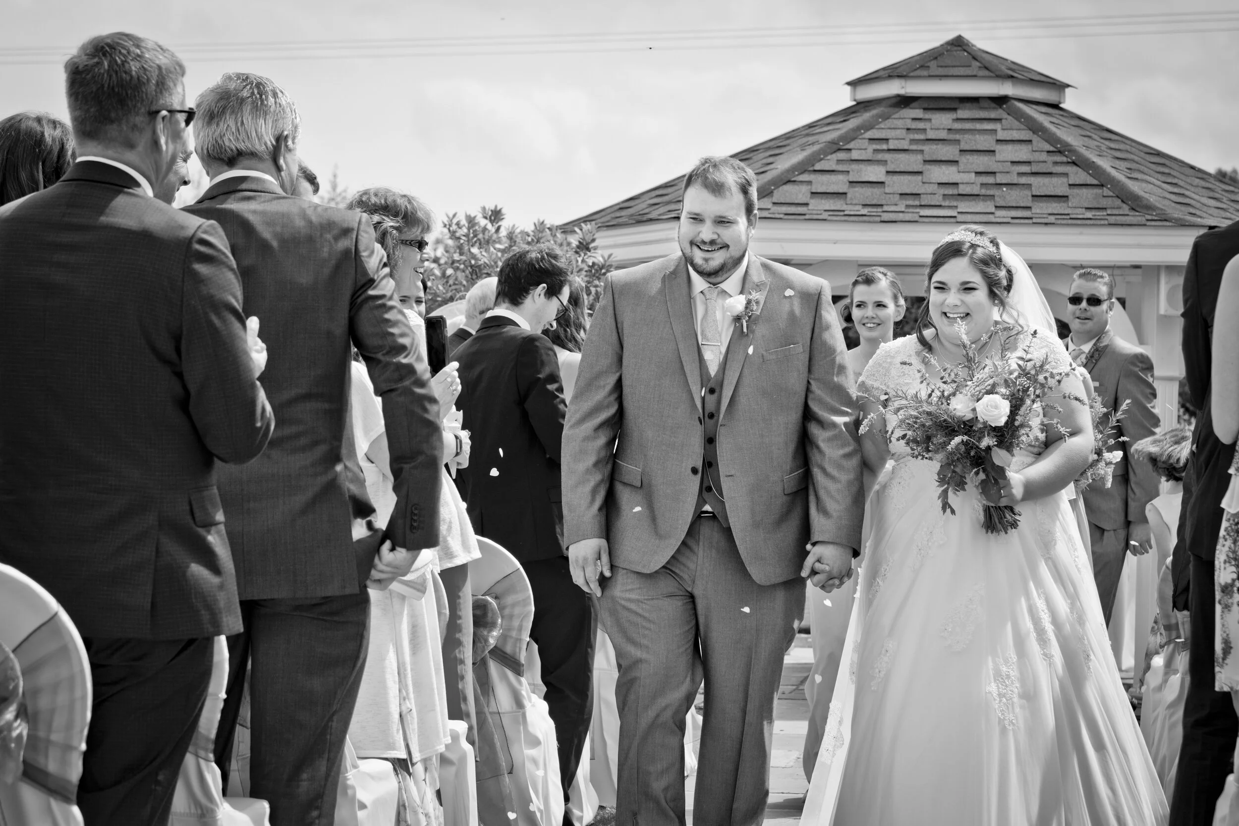 bride groom walk down aisle outdoor wedding