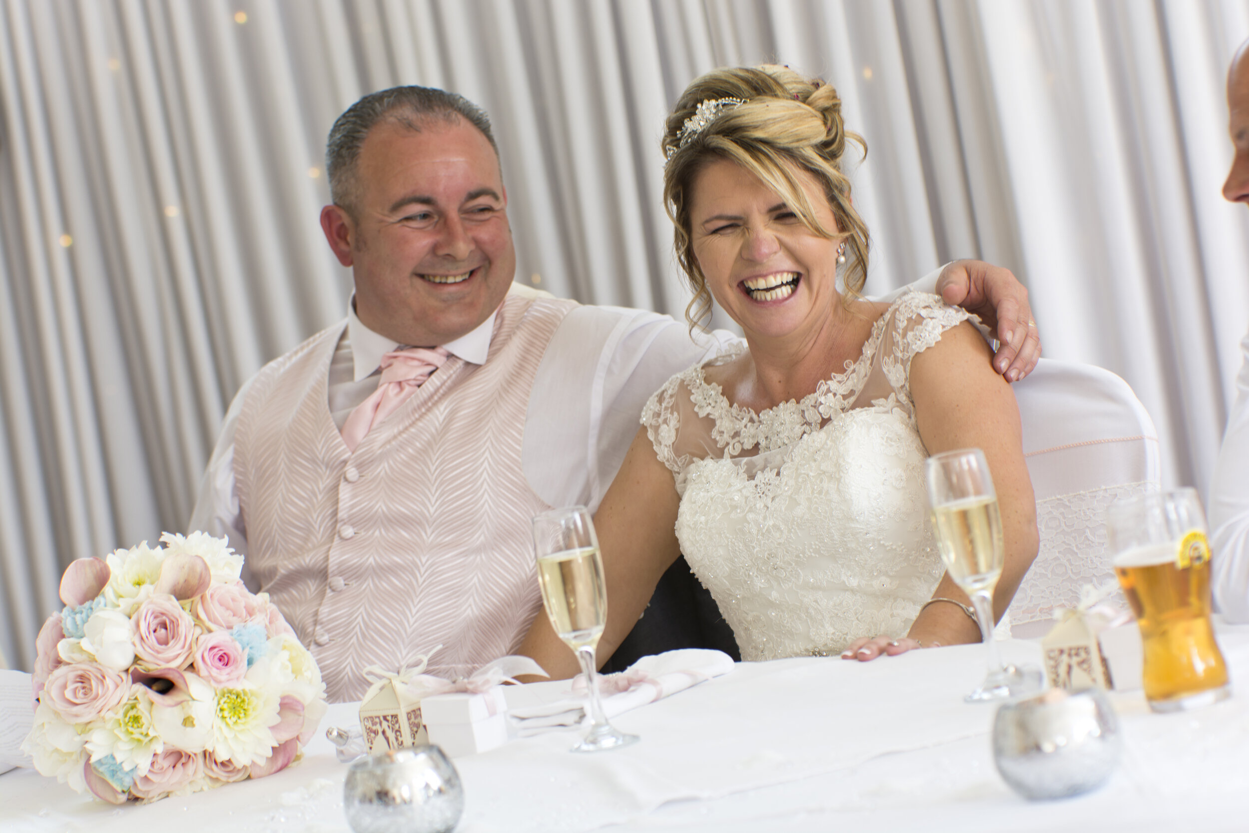 bride groom laughing wedding reception