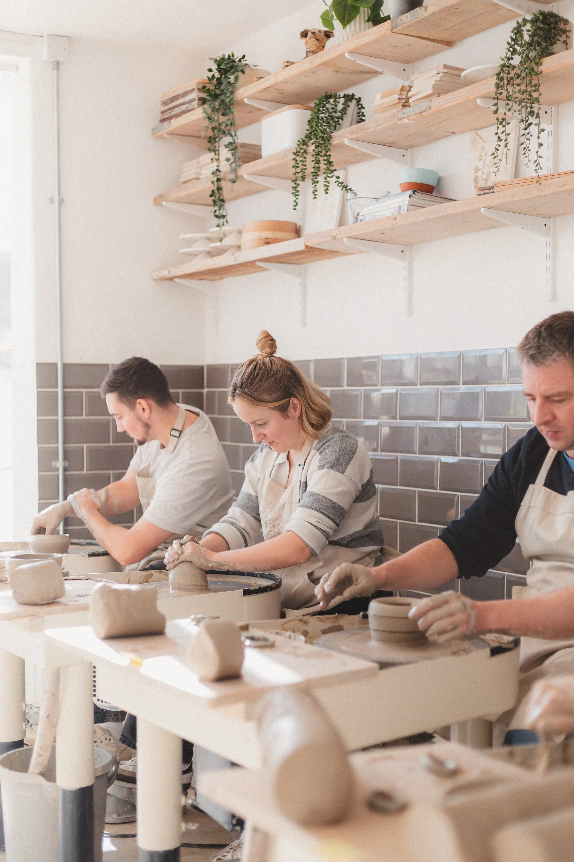 People pottery making in a ceramics class