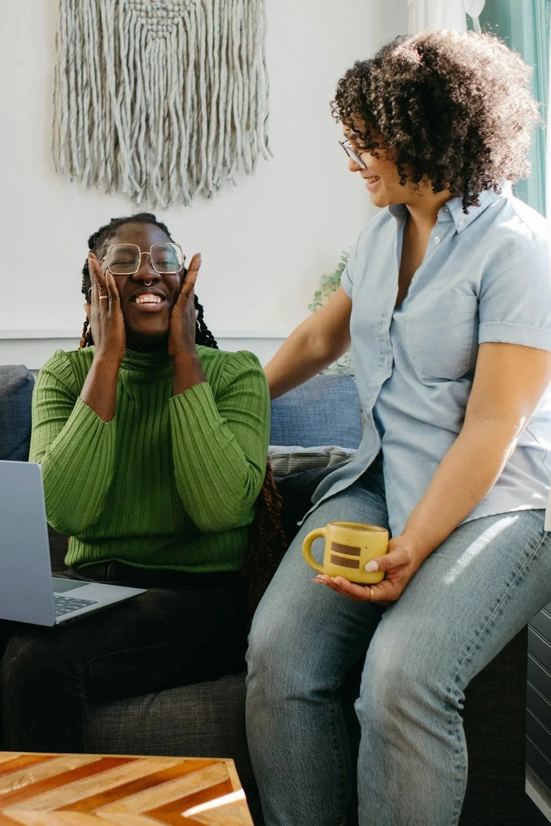 Person sitting beside a supportive professional with overlaid text reading, “You don’t have to carry everything on your own.