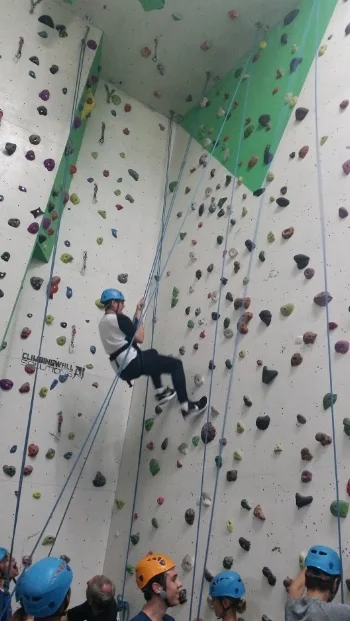 Students navigate the climbing wall