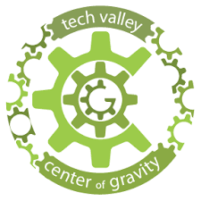 Logo of Tech Valley Center of Gravity featuring green gear and circular text.