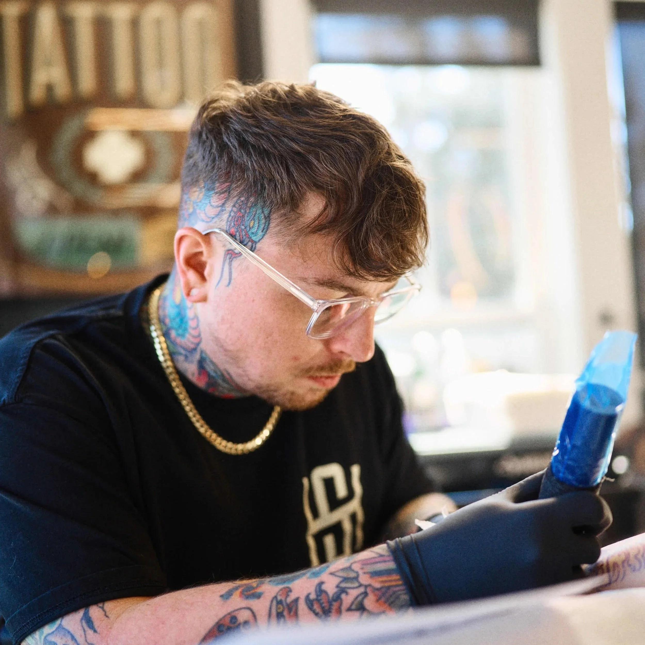 David Gottschalk tattooing a client at Safe House Tattoo Studio in Nashville, Tennessee.