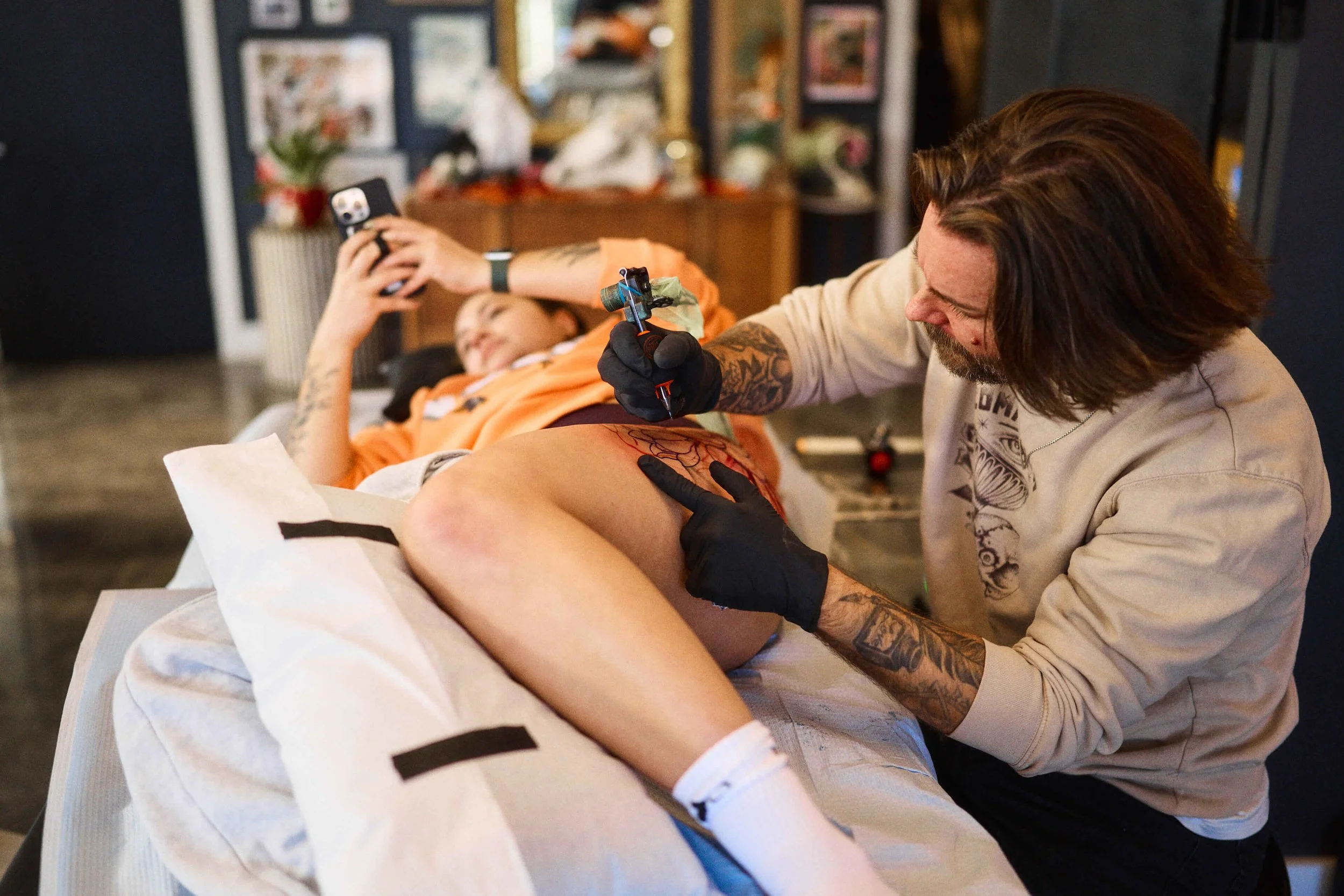 Will Campbell tattooing a black and grey tattoo using stipple shading at Safe House Tattoo Studio in Nashville, Tennessee.
