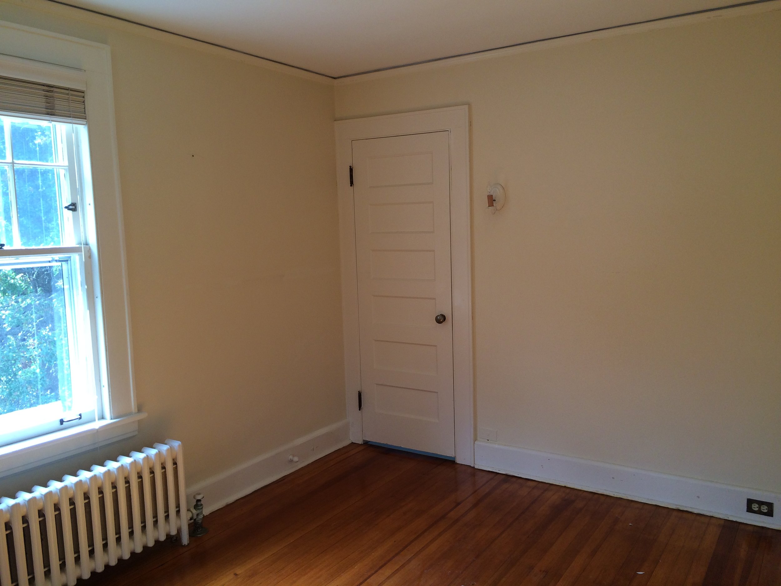 View of the door which leads to the master bath. For a small space, this room awkwardly has 2 doors. It was originally designed to be a nursery. 