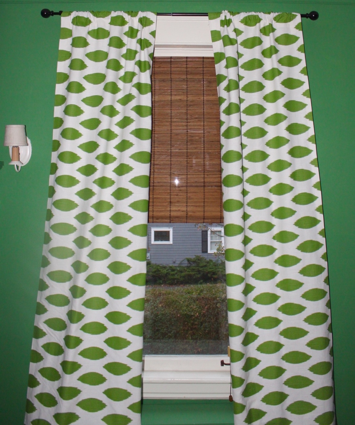 I decided to go for more traditional drapes for this window. They work better with the scale and will help to soften the look of the radiator cover below.