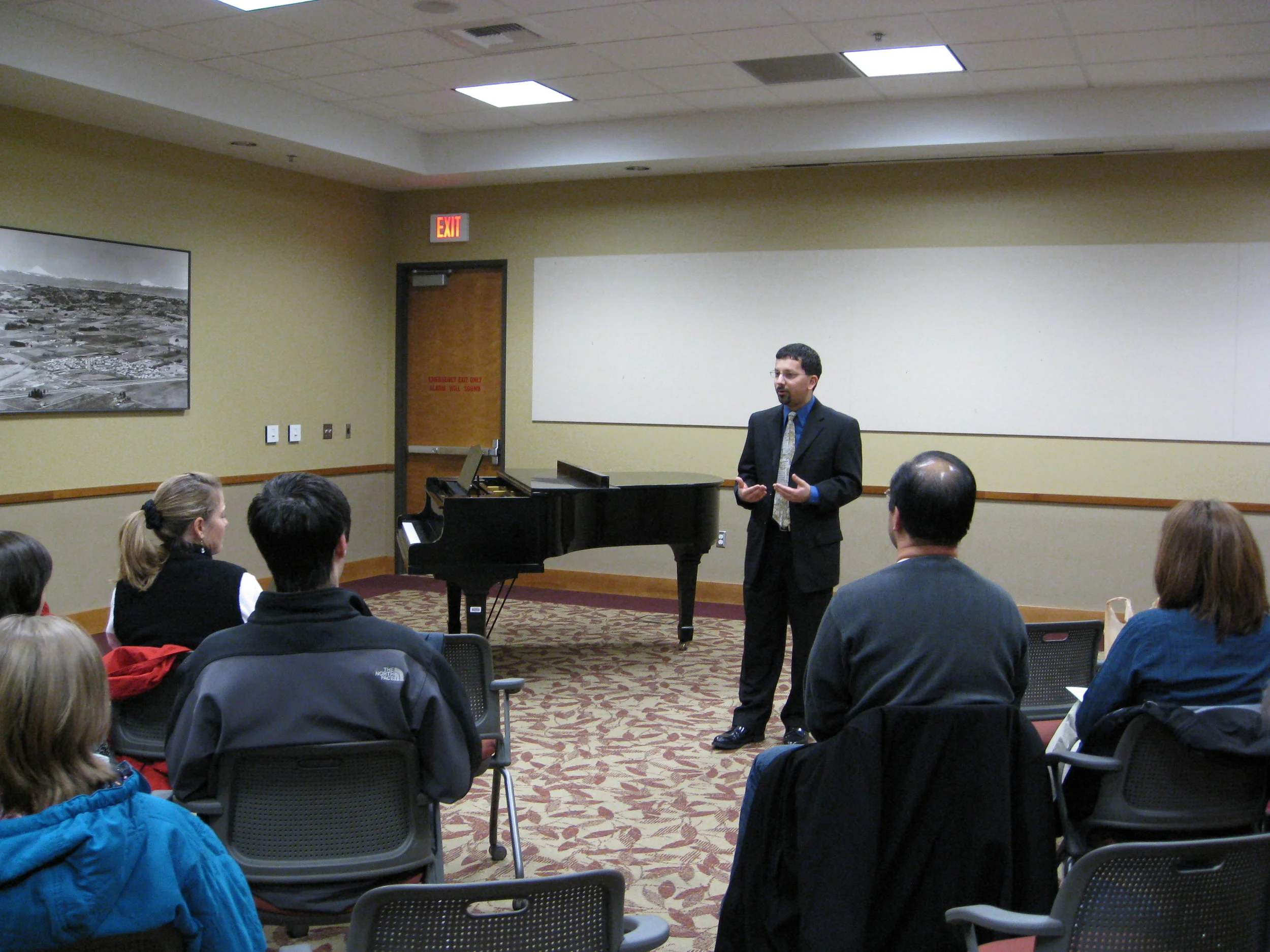  Talk with guests at one of his studio recitals. 