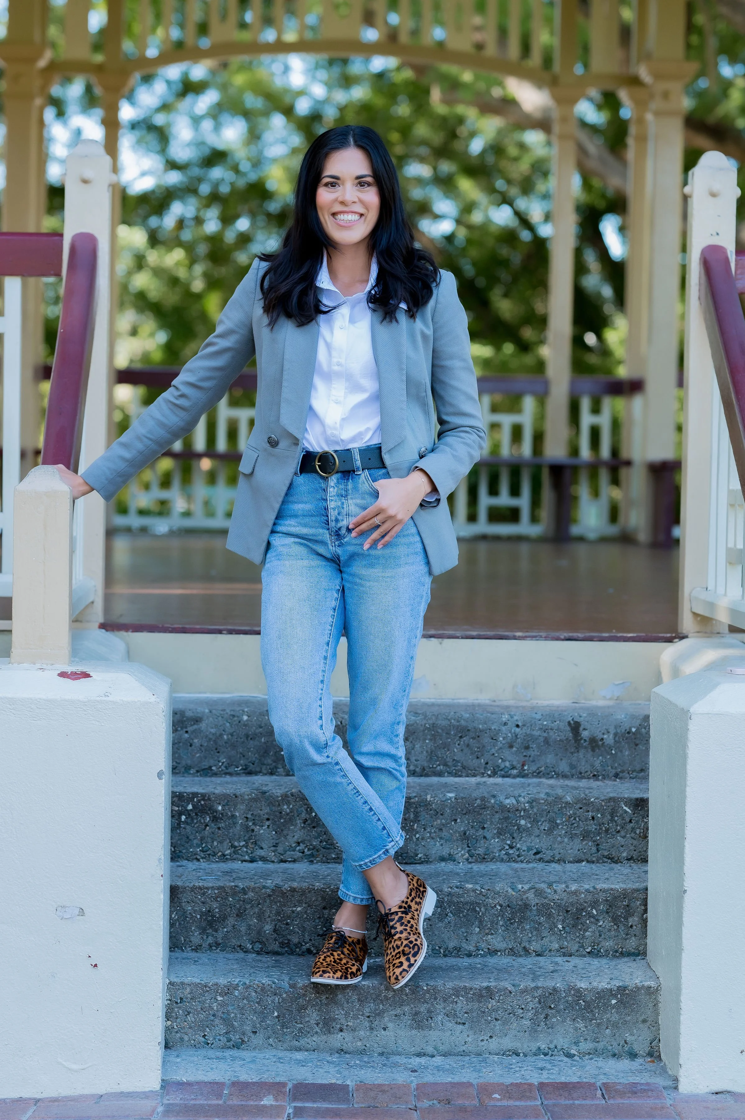 Business woman with a warm smile in the park who is a professional recruiter.