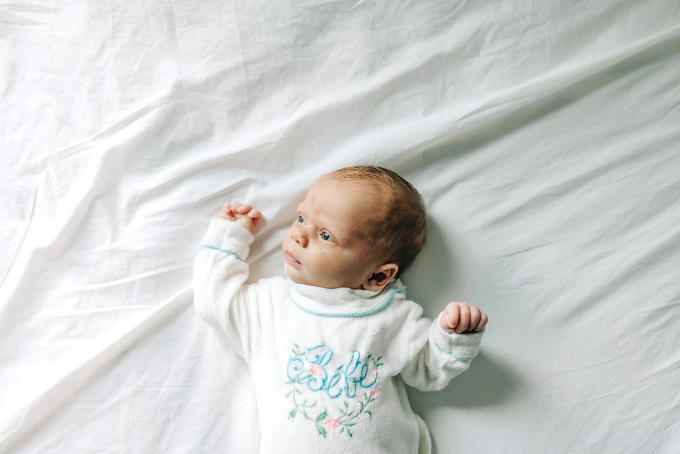 bebe vintage onesie white sheets blue eyes