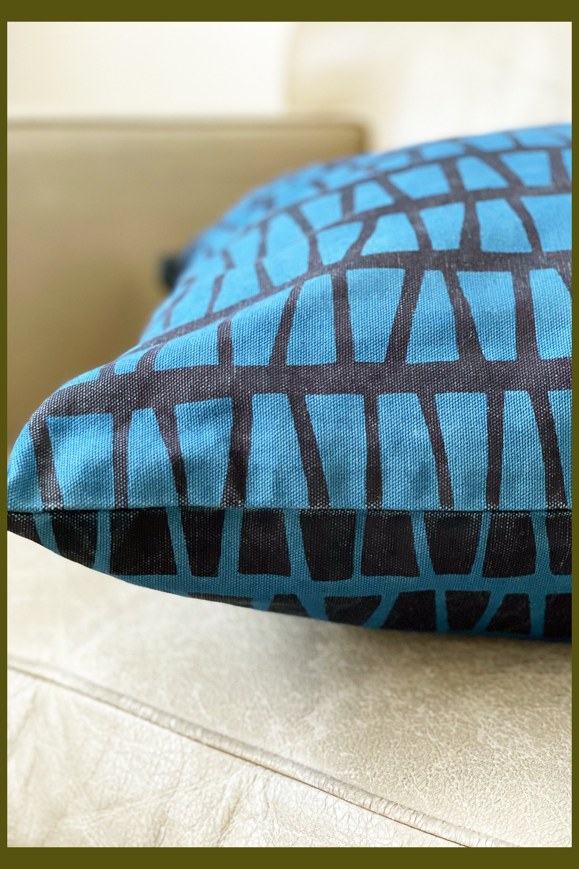 22" x 22" screen printed cushion using water based inks and indigo dyed. Cushion insert is recycled plastic bottles. This one of a kind cushion can be washed and is fixed for colour fastness.