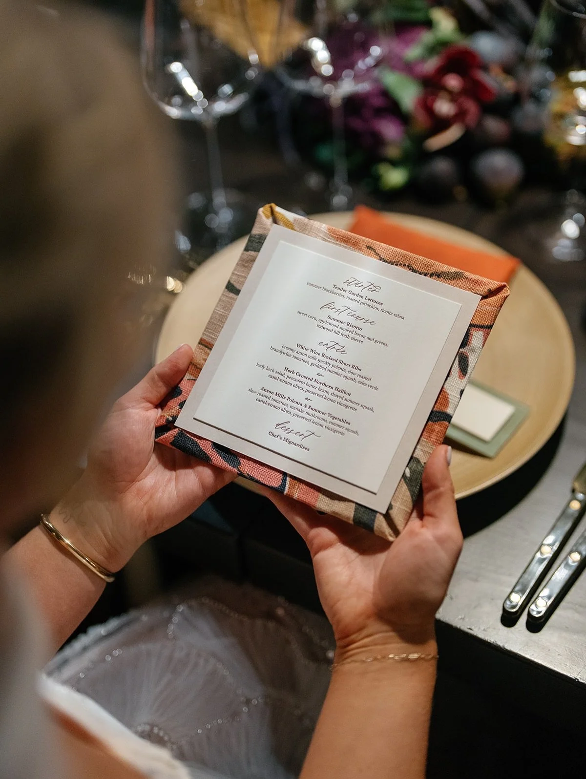 Details matter. Letterpress menus mounted on the handmade fabric-wrapped backing. When placed with the menu side down, each one was unique due to different parts of the pattern being used.

Planning and design: @asavvyevent 
Floral design: @vignettef