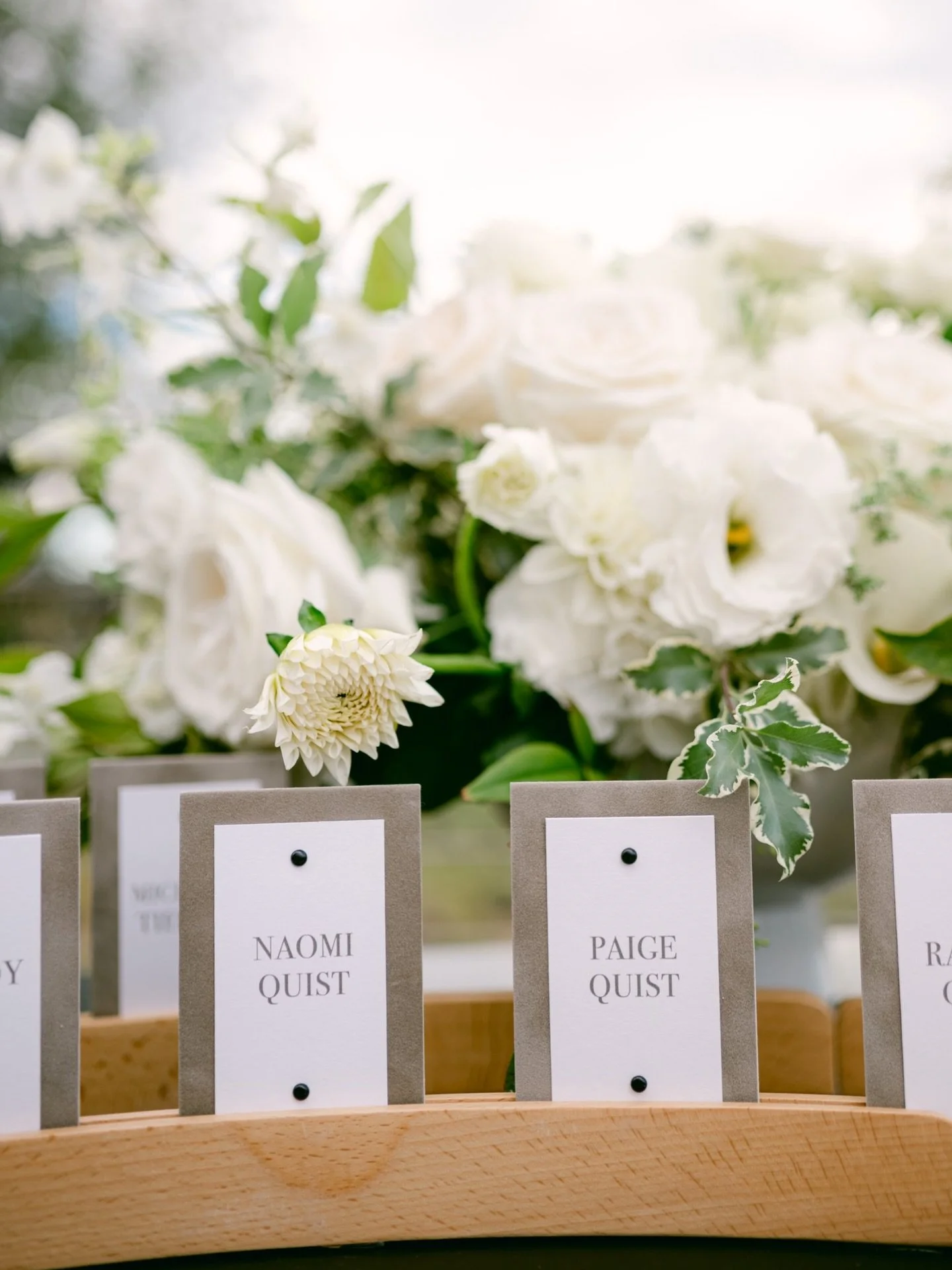 Close-up look a the escort cards from this interactive seating chart experience. The textured velvet cards unfolded to reveal the table assignment and a the beautiful venue sketch done by the groom. 

Planner: @asavvyevent 
Photographer: @scottanddan