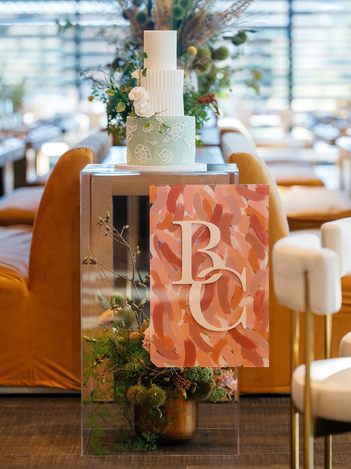Even the cake at a wedding deserves a moment. 

This custom pedestal was designed to echo the brushstroke pattern from the welcome sign + table numbers, tying every detail together into one cohesive story.

Planning and Design: @asavvyevent 
Photogra