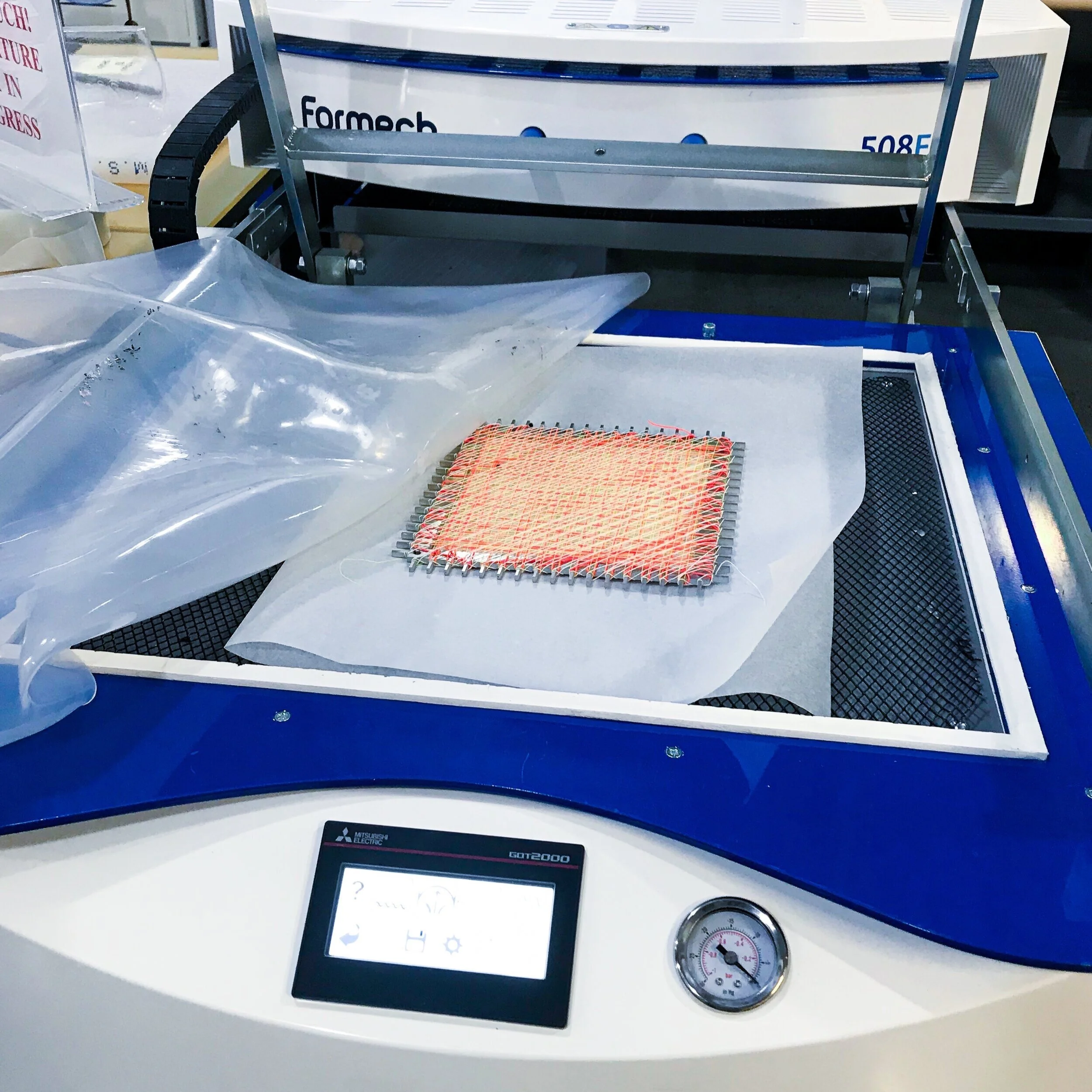 STEP 4: Put the sample into the vacuum forming machine // experiment with temperature and timing (different sample shown in image)