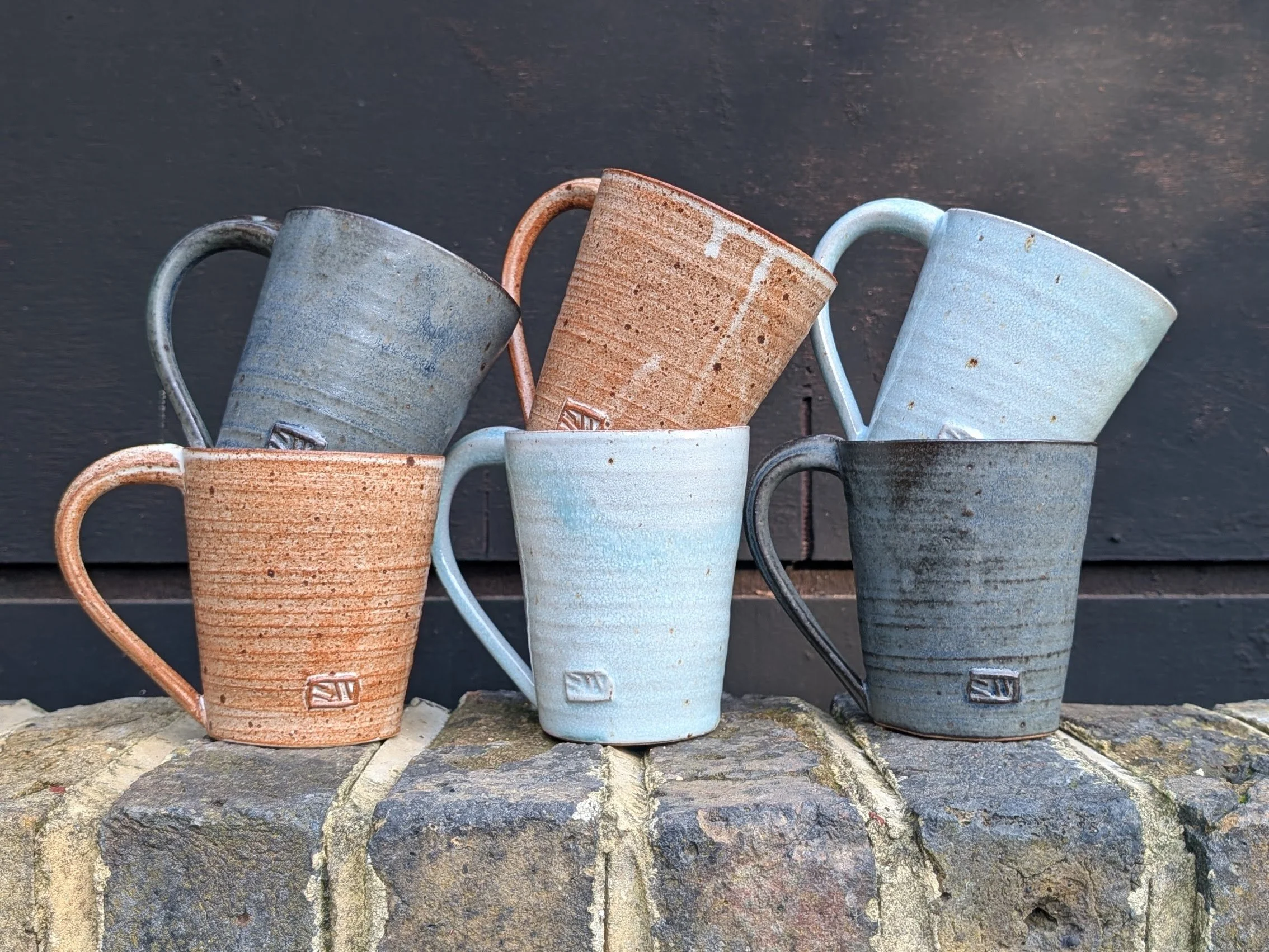 6 tall mugs on wall.jpg