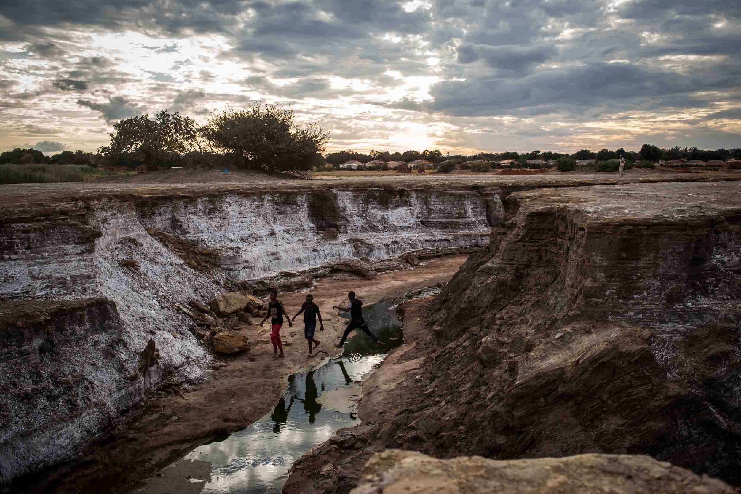  Children walk near Kipushi, a traditional mining city in the heart of Congo’s mining sector. The area has become a toxic desert  after a mining company dumped toxic waste in 1930, killing all the vegetation. The dominant mining narrative in DRC is a