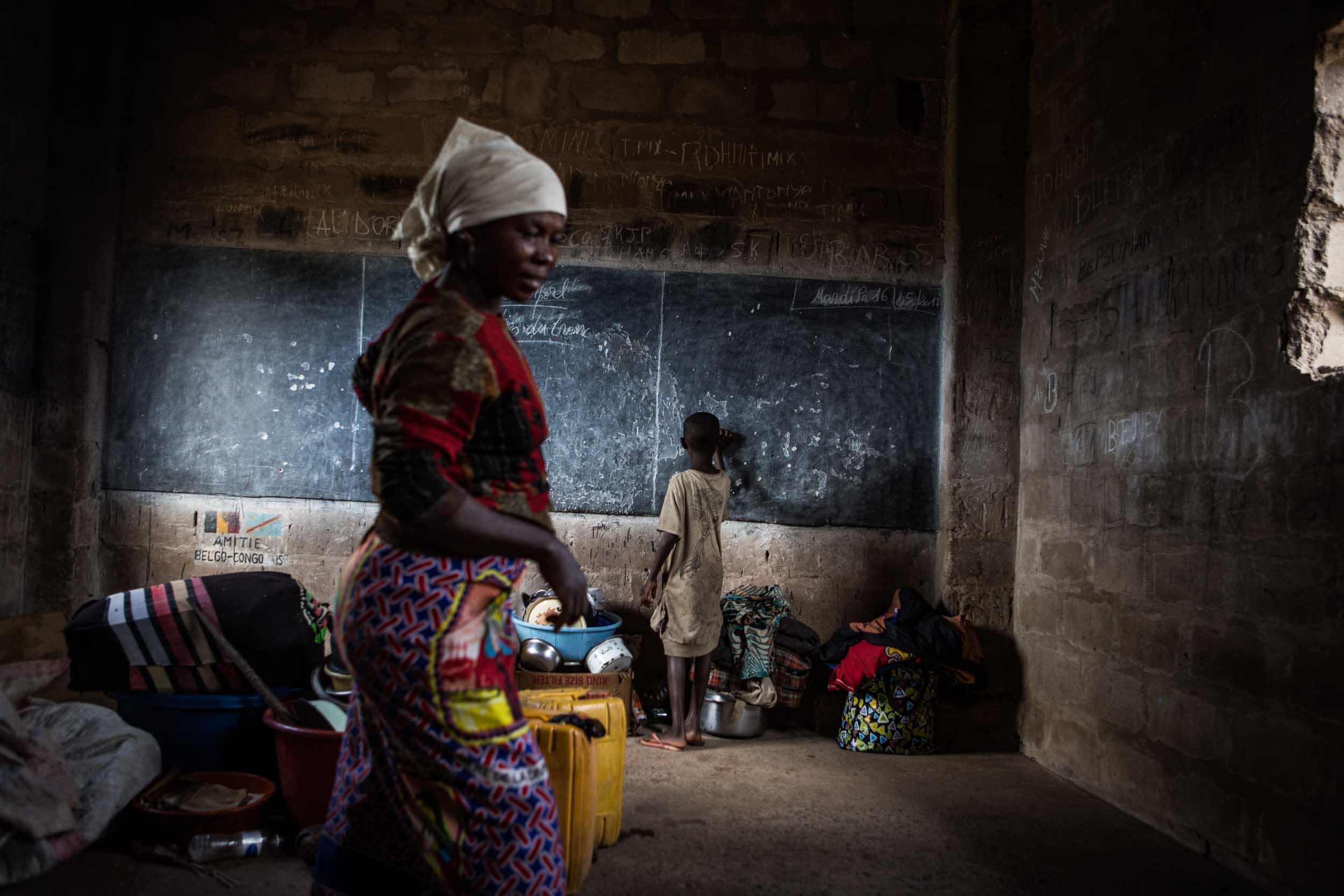  A Bantu woman and child in one of the rooms of the Circle Filtsaf primary school in Kalemie, where they found shelter after escaping the violence in their home village of Tabacongo. They arrived here at the beginning of May and are waiting to be rel