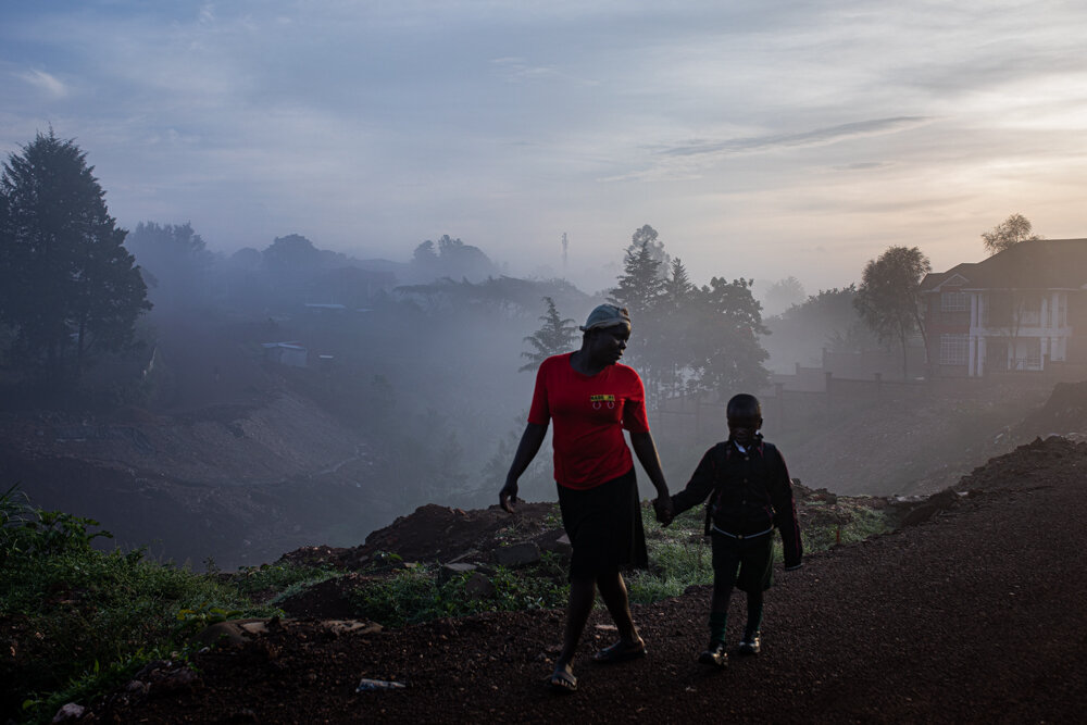  A woman walks her son to school in Kakamega town. Kakamega county is one of the regions in Kenya with the highest Malaria infections of up to 20 percent. Besides Kakamega, the childhood immunization programme which was launched in September 2019, is