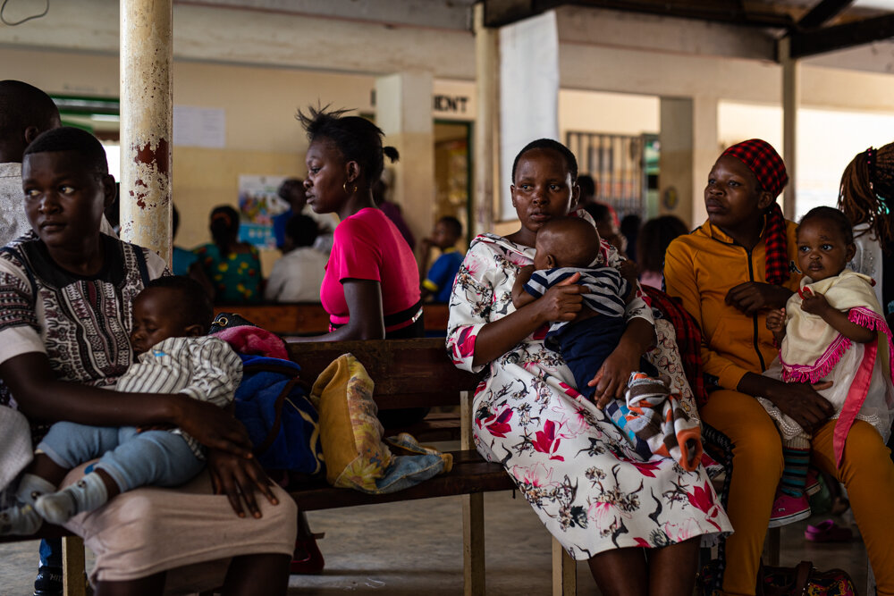  Women wait at Iguhu District Hospital in western Kenya so that their babies can receive the malaria vaccine. In Africa, about 285,000 children died before their fifth birthdays in 2016. 