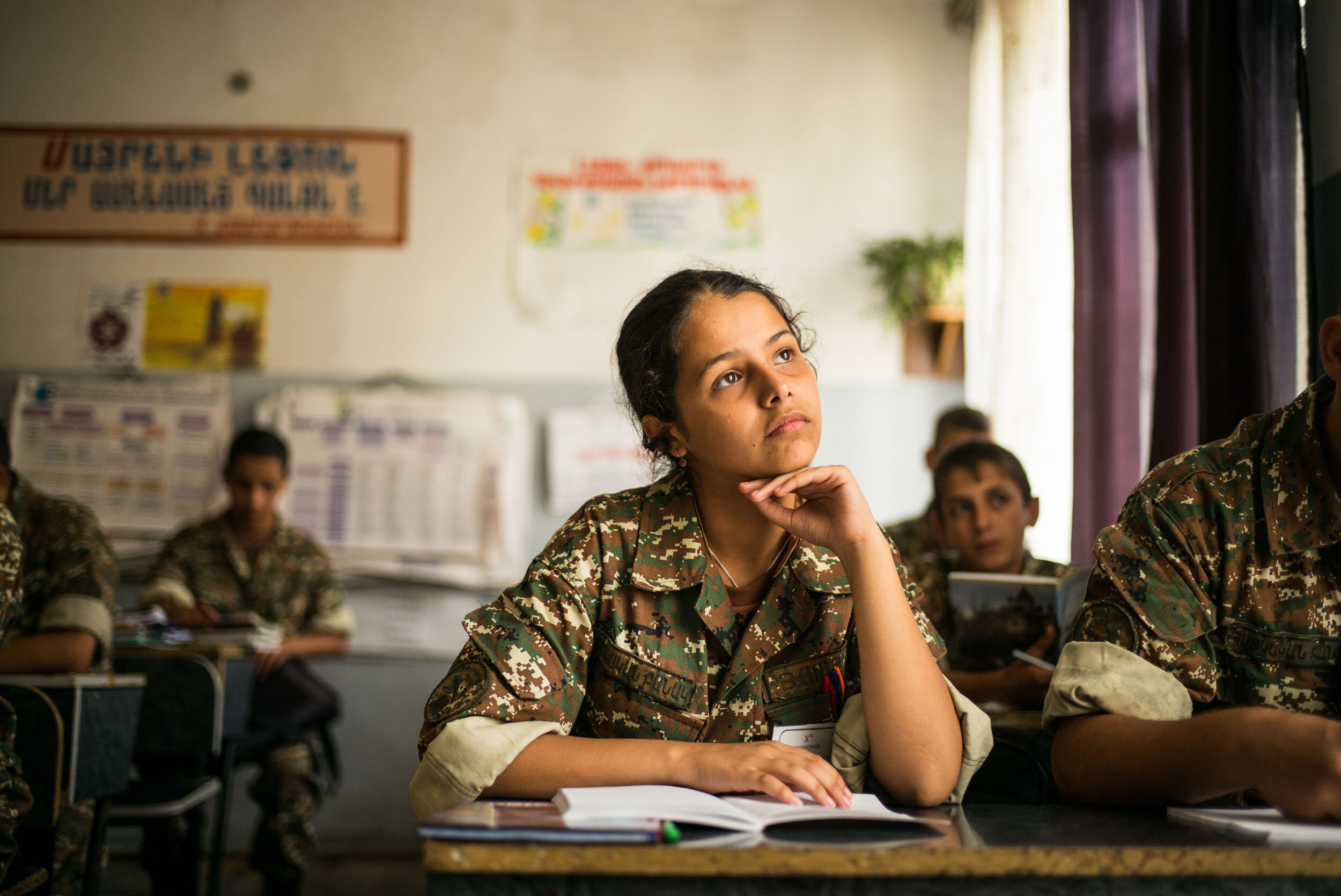  Lena, 15, during clases at Stepanakert Military High School in the self-proclaimed region Nagorny Karabakh. She is one of the first 11 girls who were admitted into this military institution in 2016. 