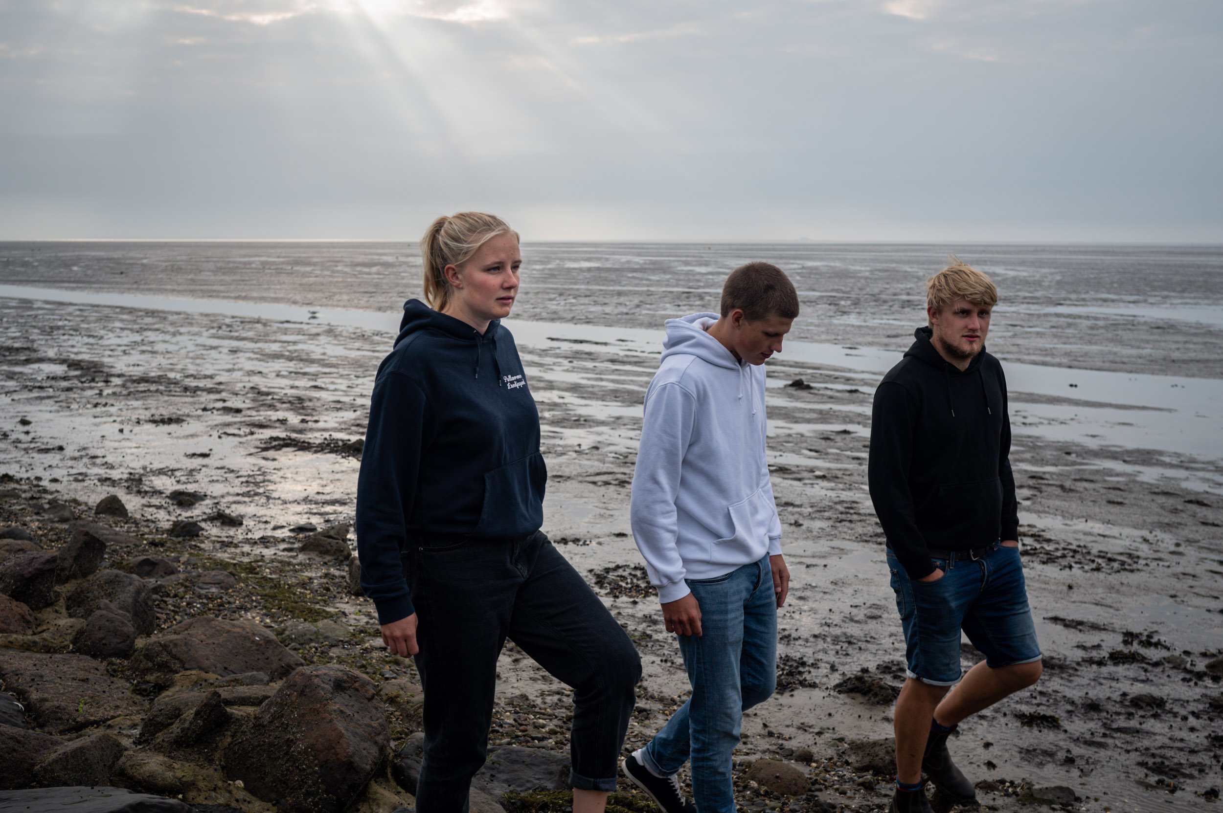  Backsen siblings Sophie, 23, Hannes, 19, and Paul, 21, on the island of Pellworm. Their family took Ms. Merkel’s government to court over its carbon dioxide emissions. 