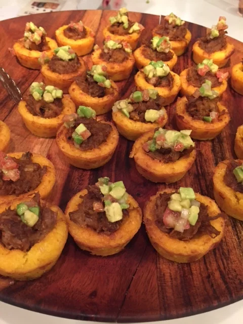 Mini BBQ Pork Buns and BBQ Chicken in Masa cups with avocado relish.