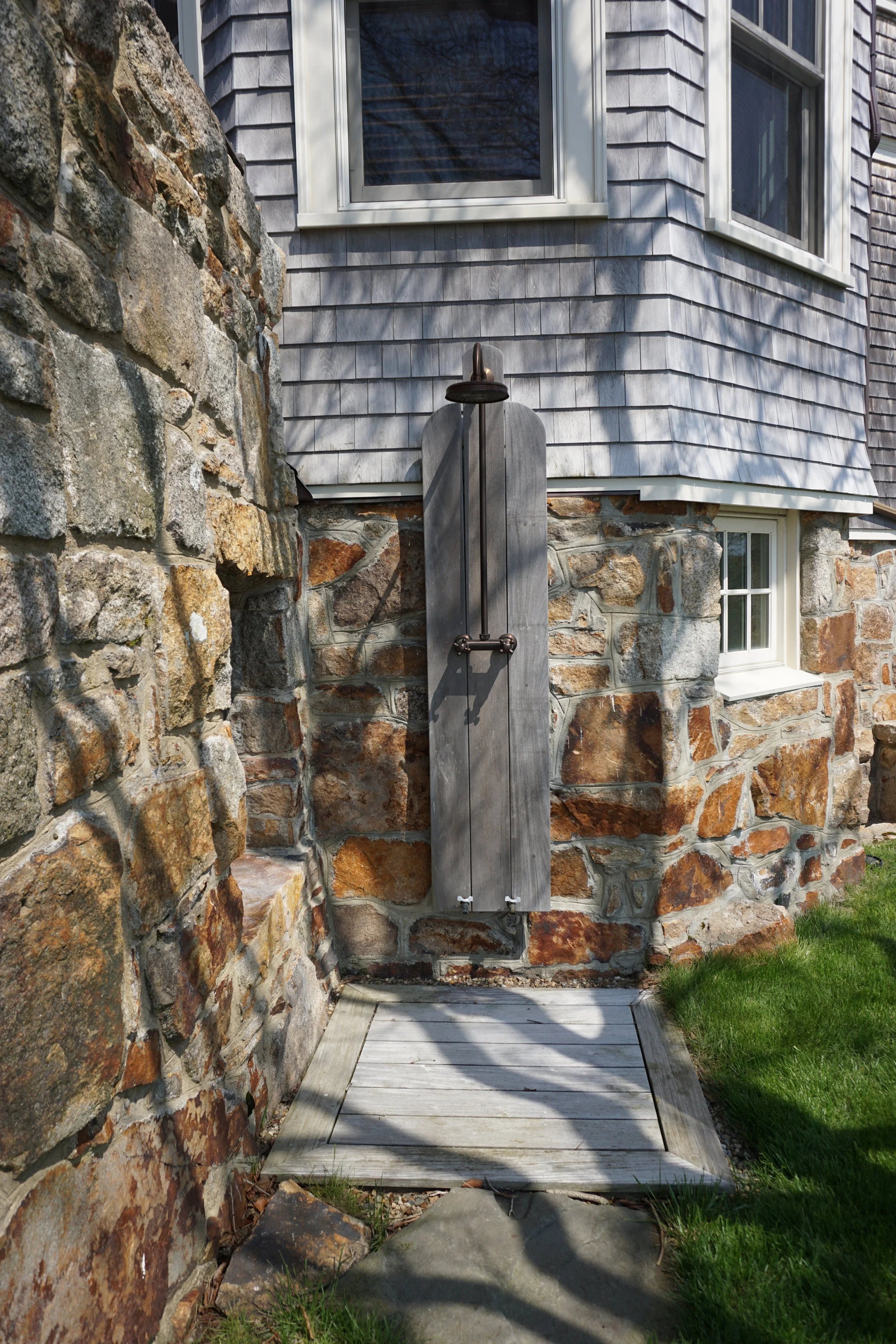 An outdoor shower is in place to rinse off after a day enjoying the ocean.