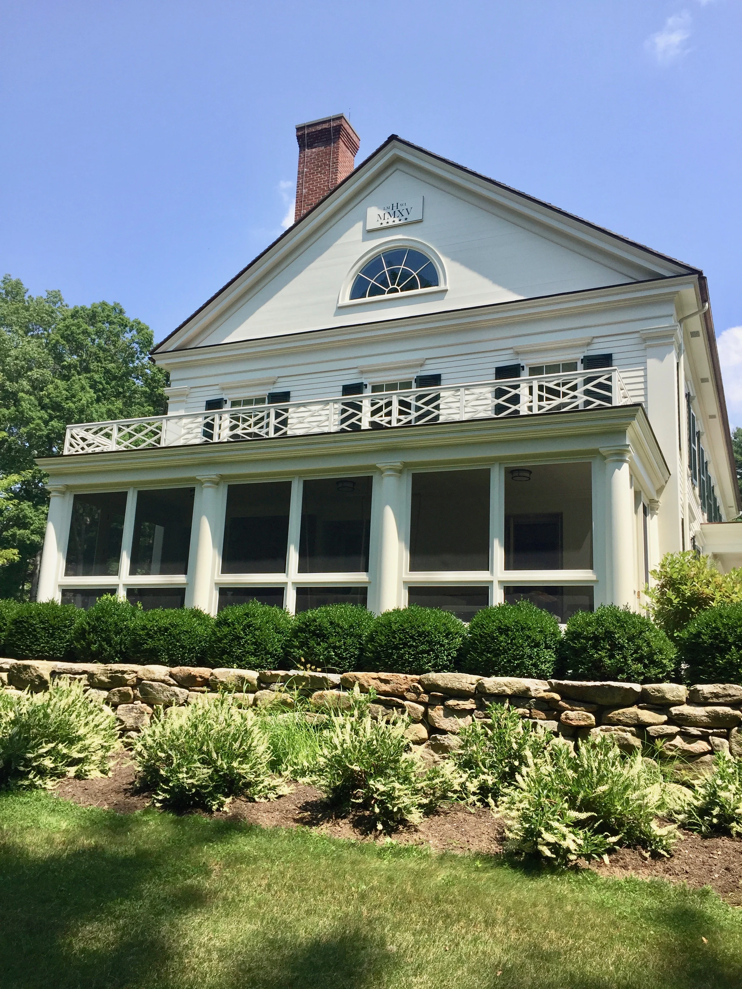 at the end gable of the home, Lauren and Bill have a sign representing the year the home was built and the stars at the bottom represent their five children. - Photo: Linda davis
