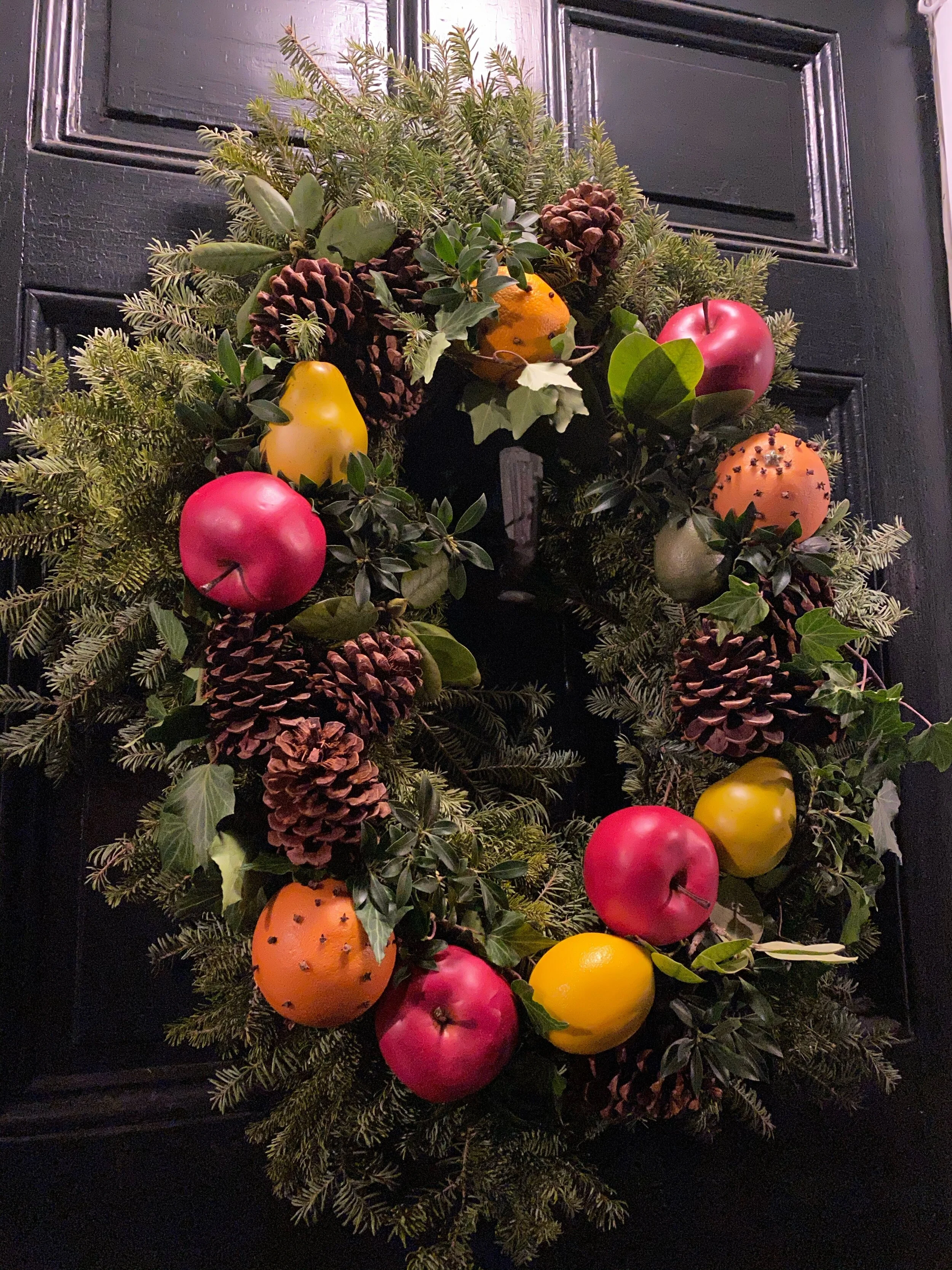Creating a faux fruit Colonial style Christmas wreath and pineapple urns. 