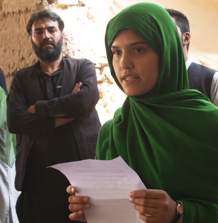 Aziza, a senior, speaks publicly in front of men for the first time in her life at the groundbreaking ceremony for the Razia Jan Institute