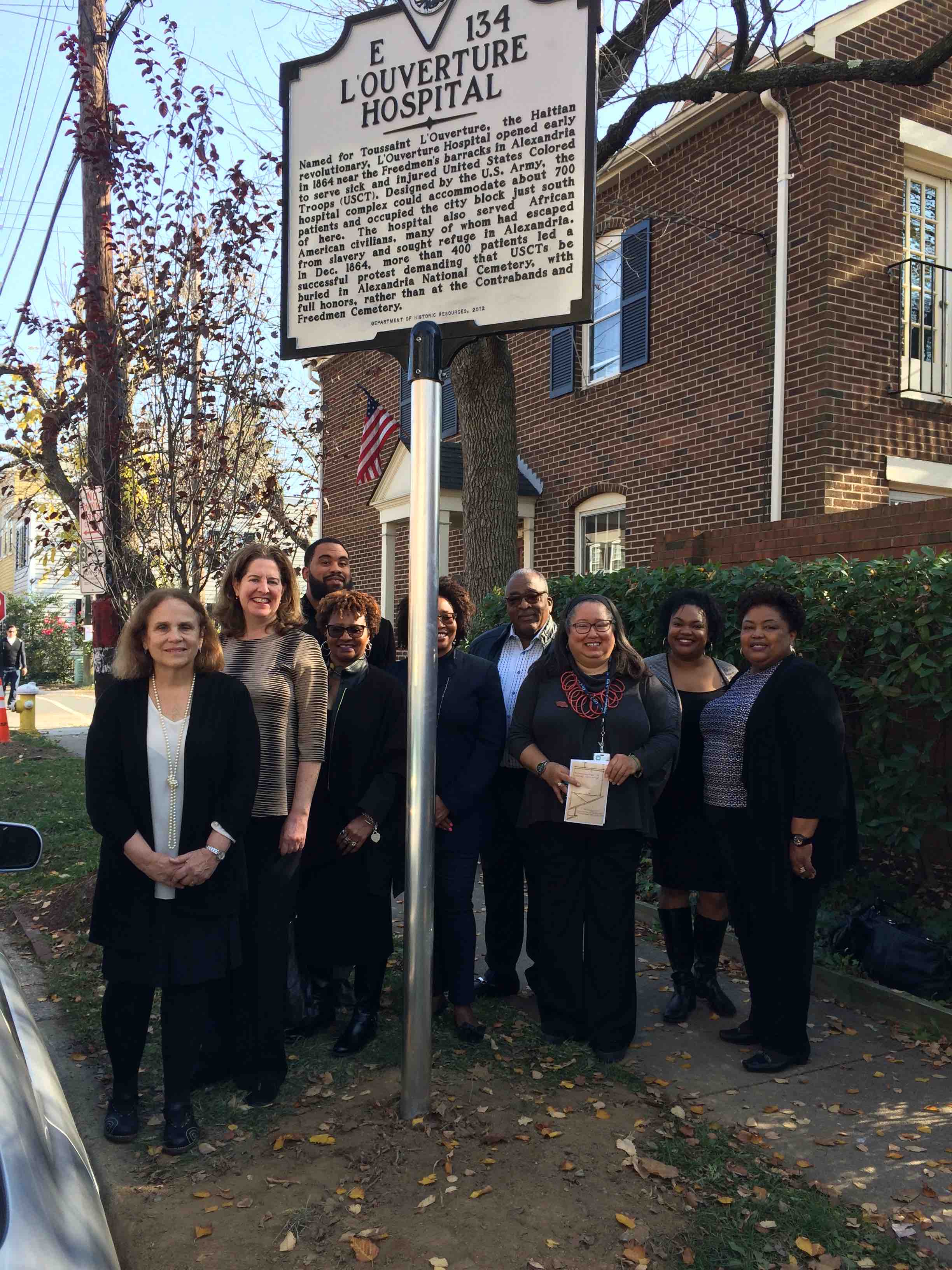 New sign, with City Archaeologist Fran Bromberg, Mayor Alison Silverberg, members of the Shiloh Baptist Church Choir, and Alexandria Black History Museum Director Audrey Davis. Photo by Ruth Reeder.