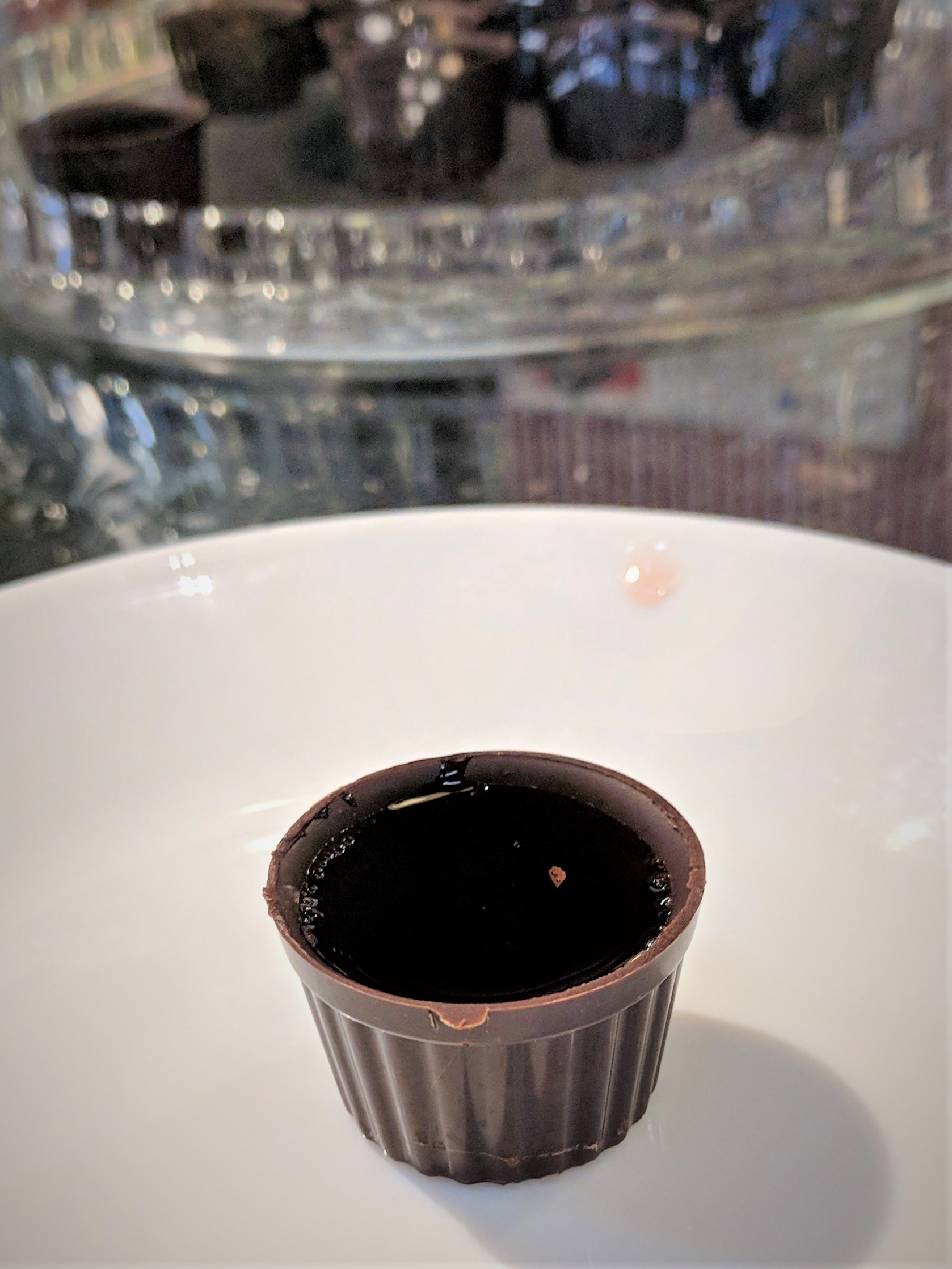 Ginja, a sour cherry liquor, in an edible chocolate cup