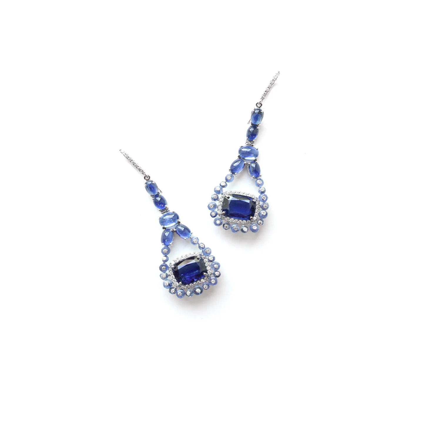  Asha Eardops   $29,600.00     A pair of eardrops set in eighteen-karat white gold, featuring a collection of deep blue sapphires and kyanites, accented with white diamonds.    Eardrop Length –approximately 2 ½ inches     This piece is one-of-a-kind 