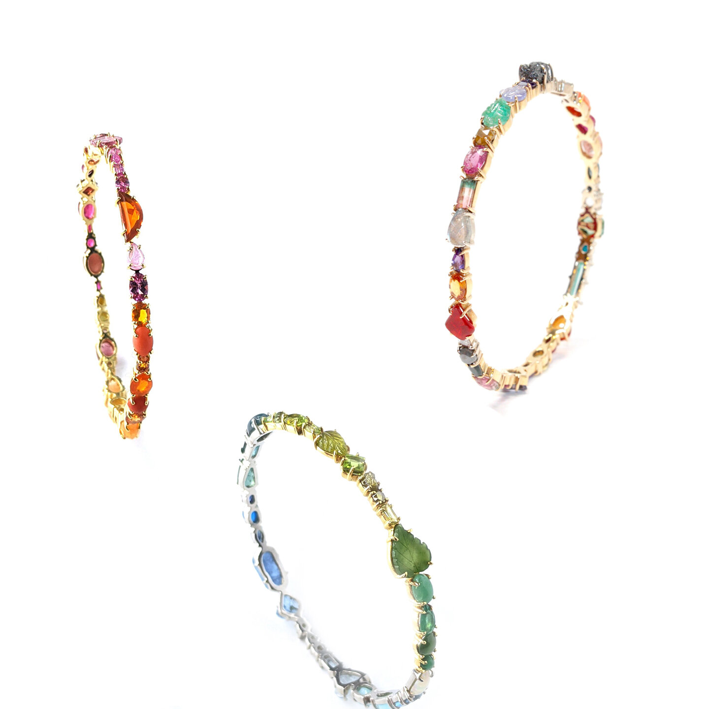  Baby Bangles  $17,600 - $20,000  Eighteen-karat gold  or platinum hinged bangles set entirely with diamonds and gemstones in a variety of shapes and sizes.    